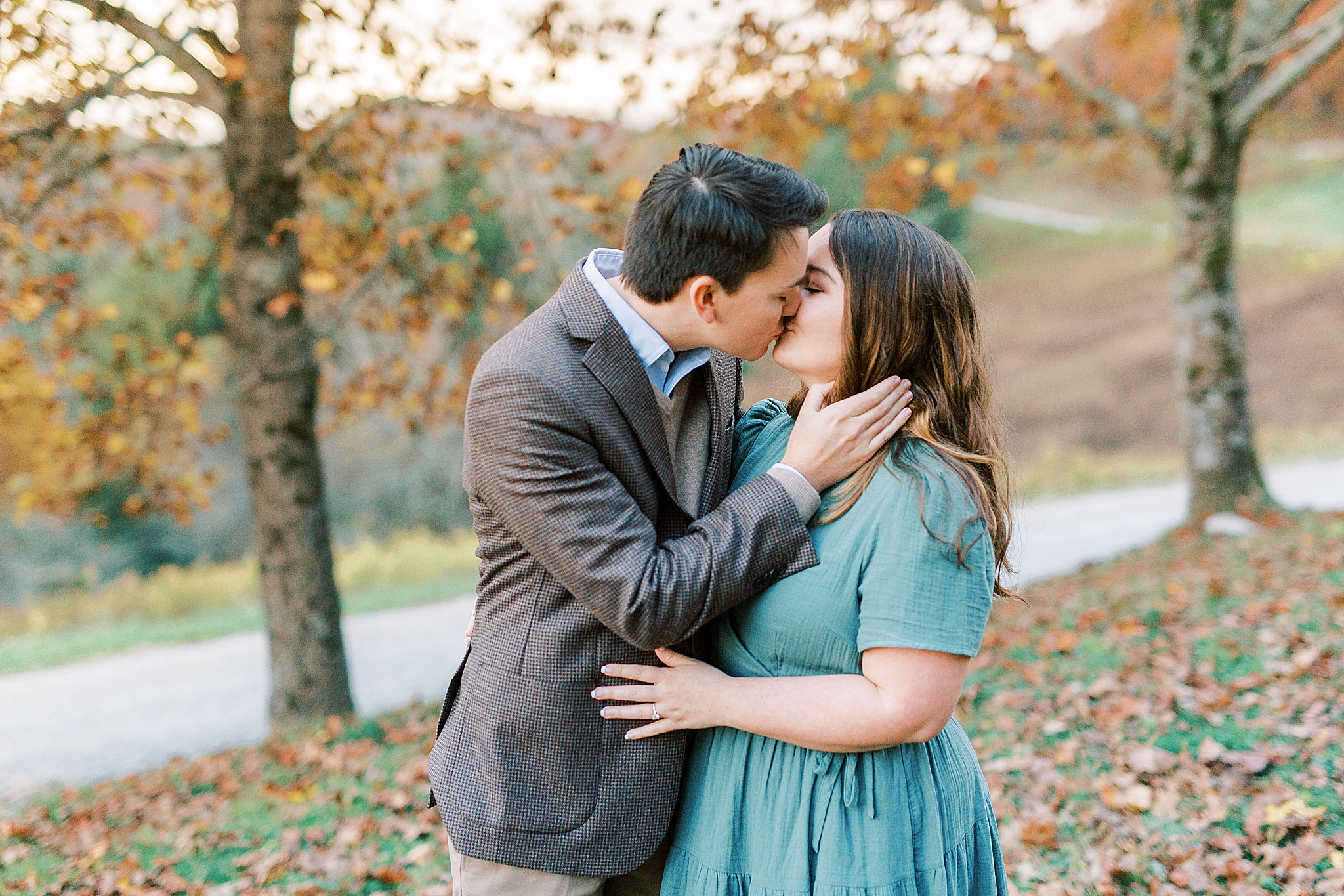 engaged couple kisses in Boone NC