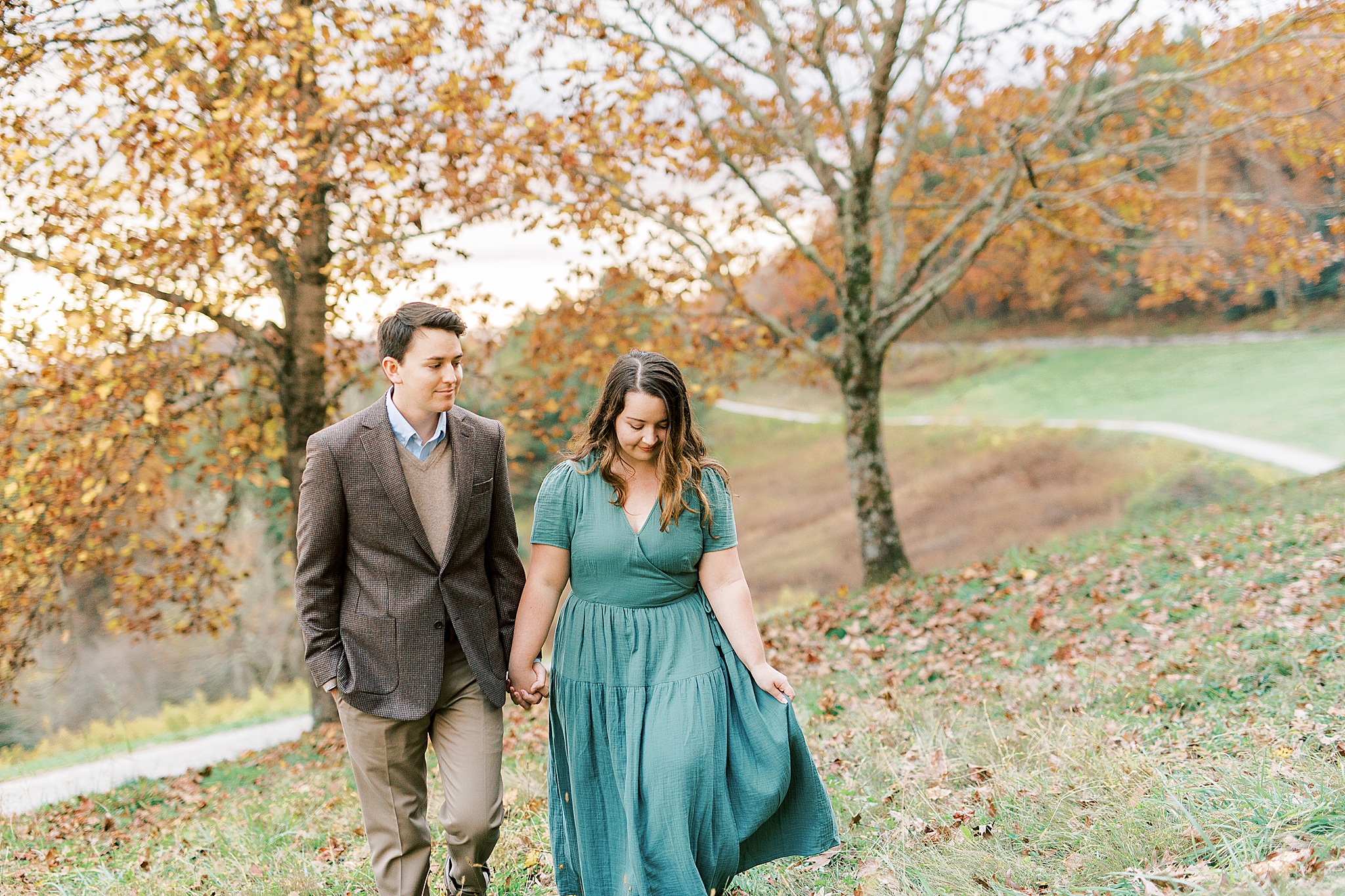 couple walks through hillside in North Carolina