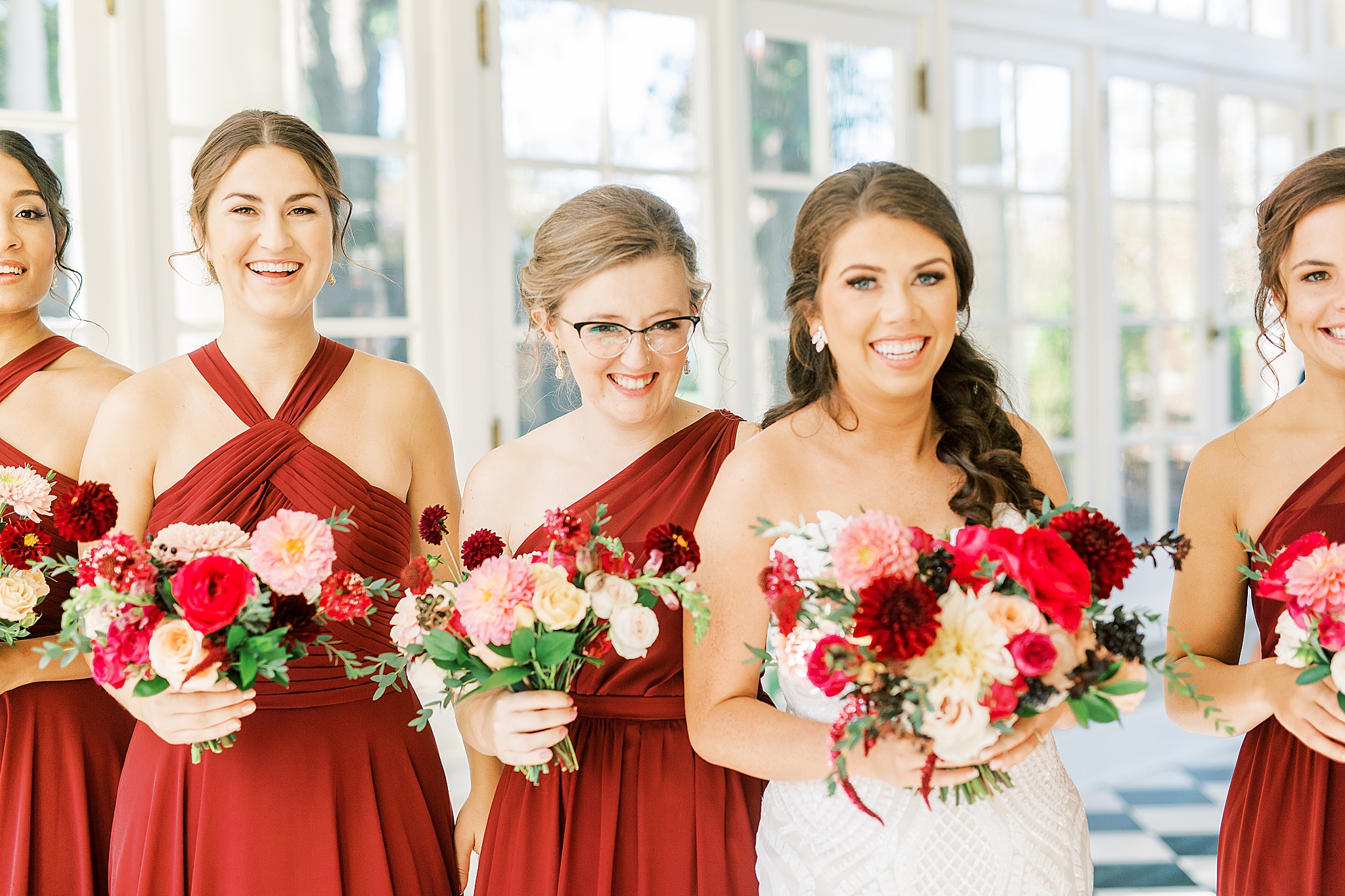 bride smiles with bridesmaids during portraits at Separk Mansion