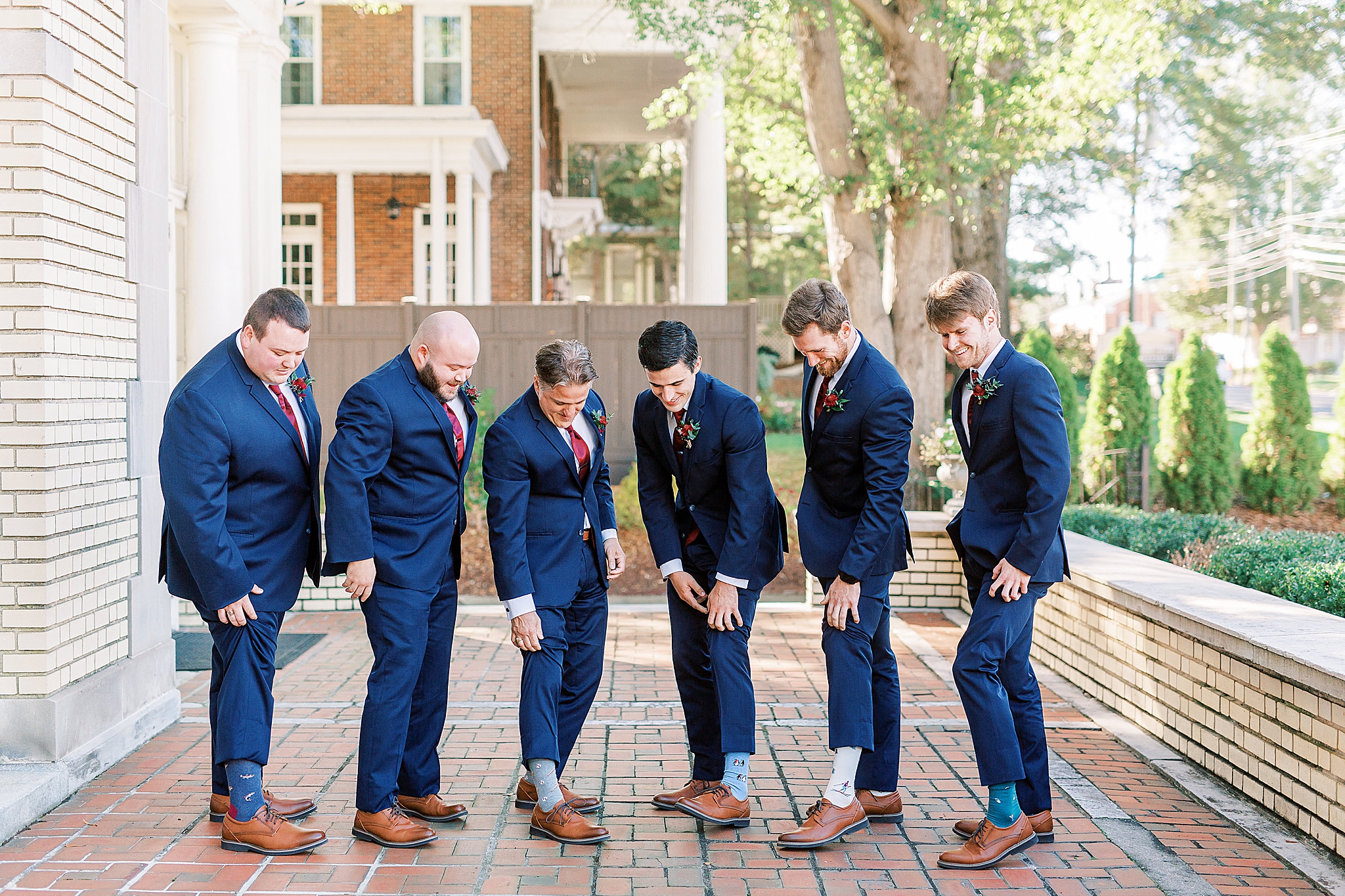 groomsmen show off custom socks