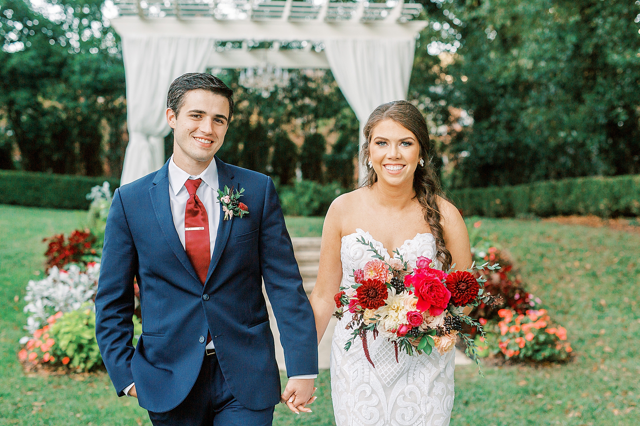 bride and groom walk through gardens at Separk Mansion