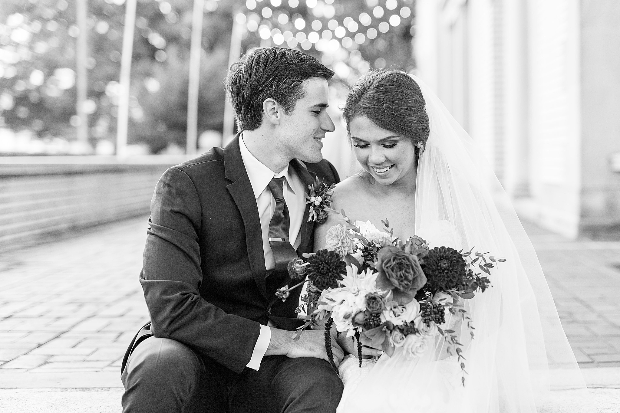newlyweds laugh during NC wedding portraits at Separk Mansion