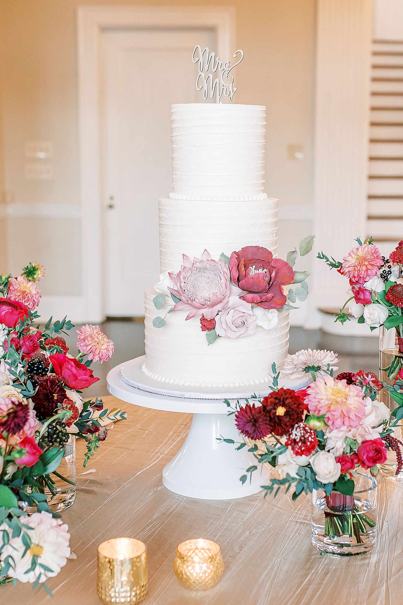 tiered wedding cake with pink florals