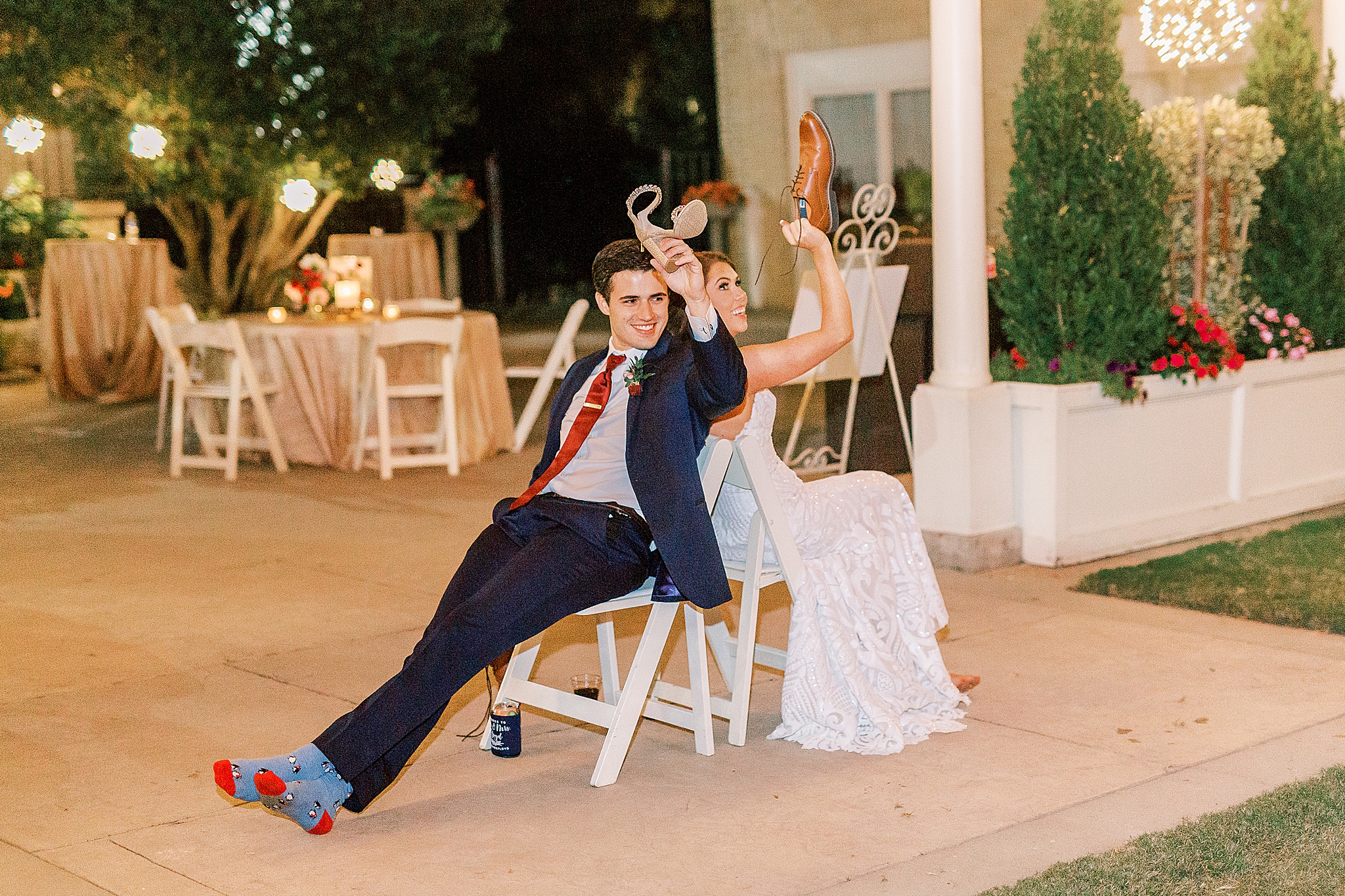 bride and groom play shoe game during wedding reception
