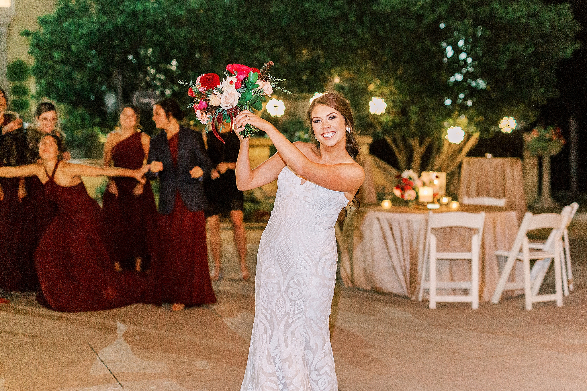 bouquet toss during Dinner Party Wedding reception at Separk Mansion