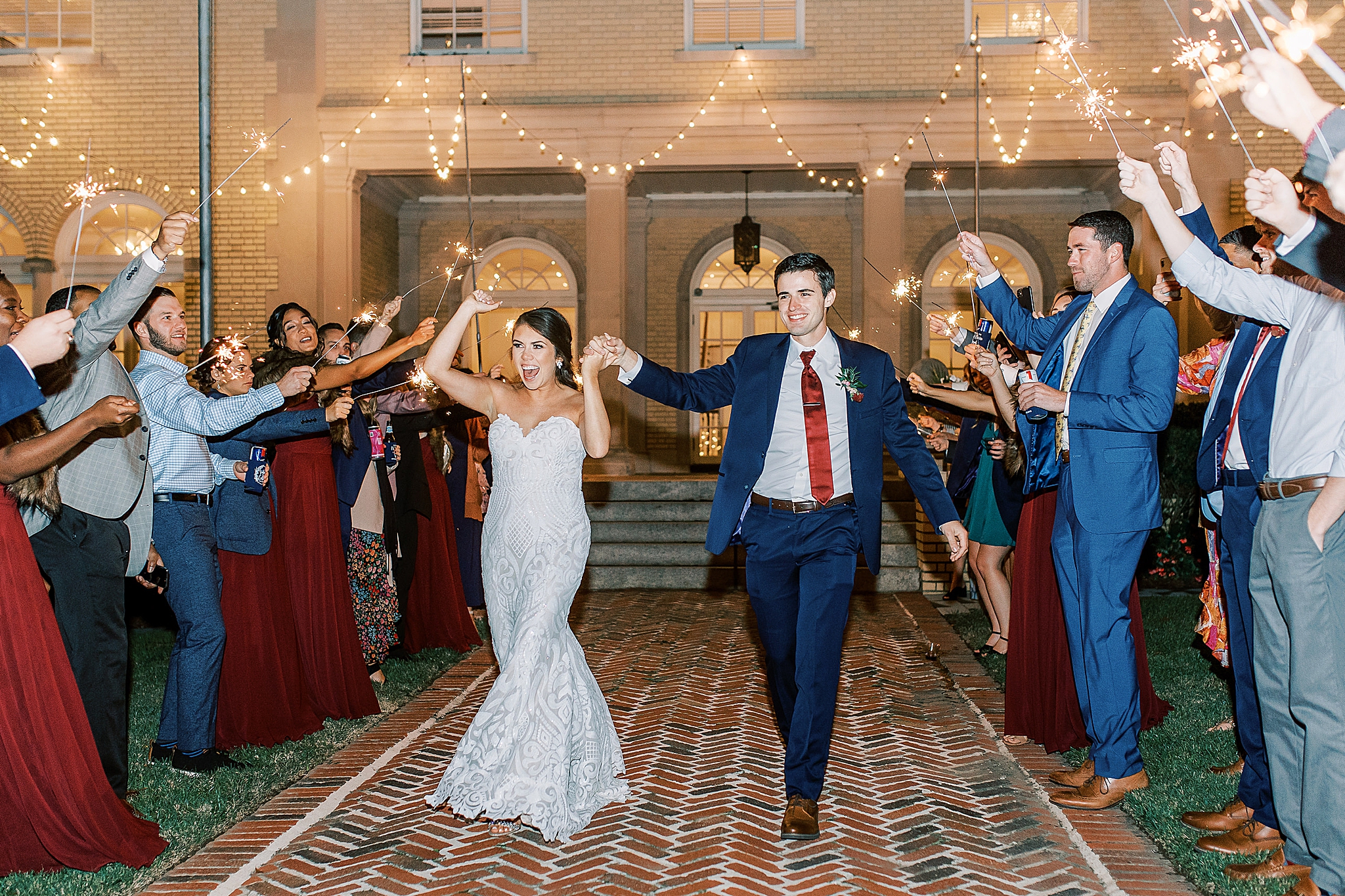 bride and groom leave Dinner Party Wedding with sparkler exit