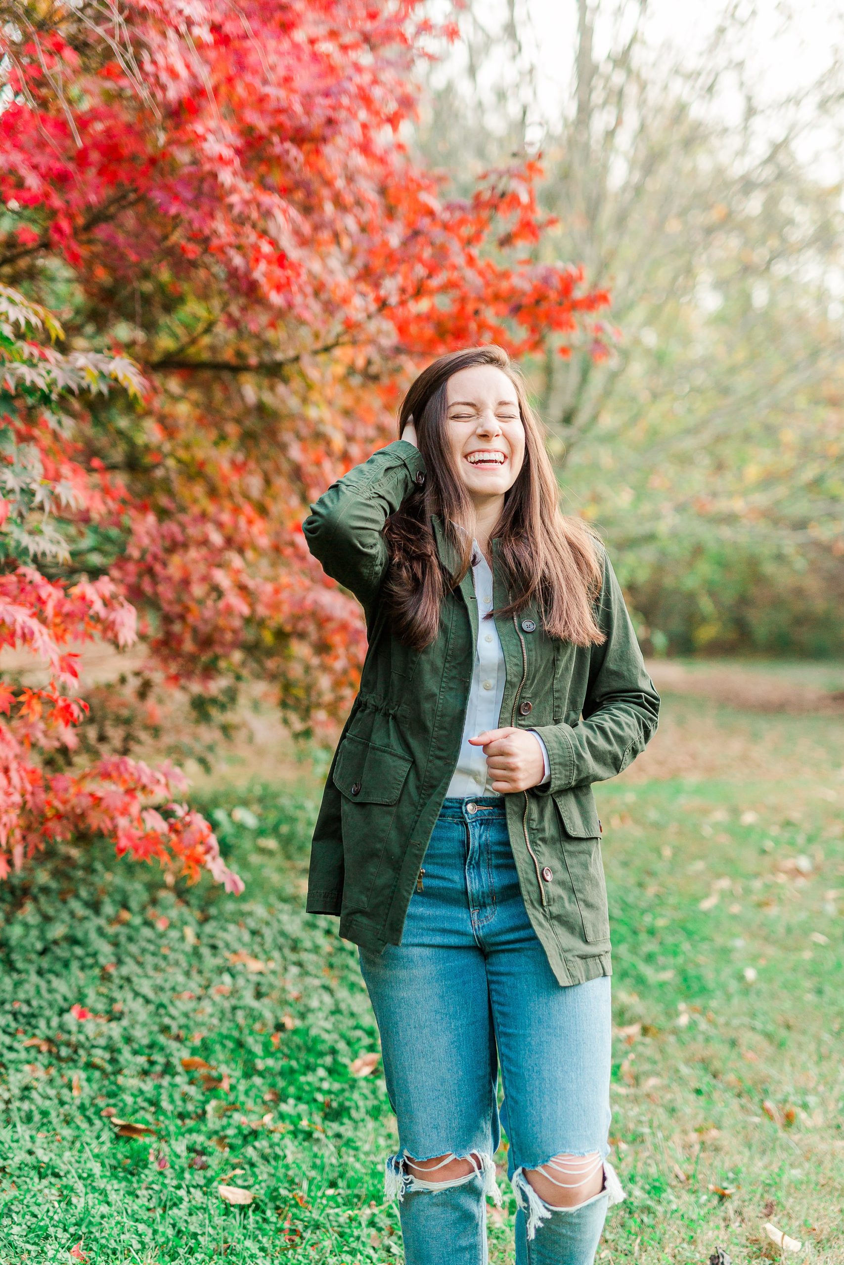 senior girl laughs during portraits at Sloan Park