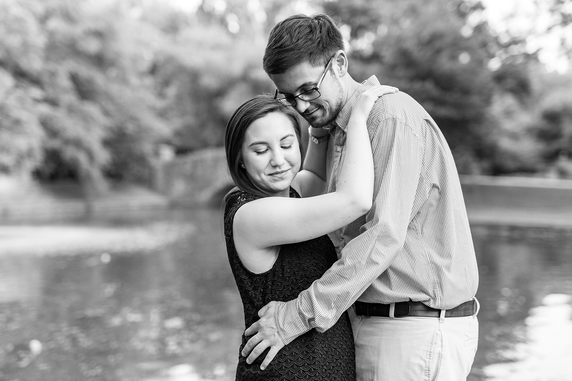 engagement portraits by pond in Freedom Park