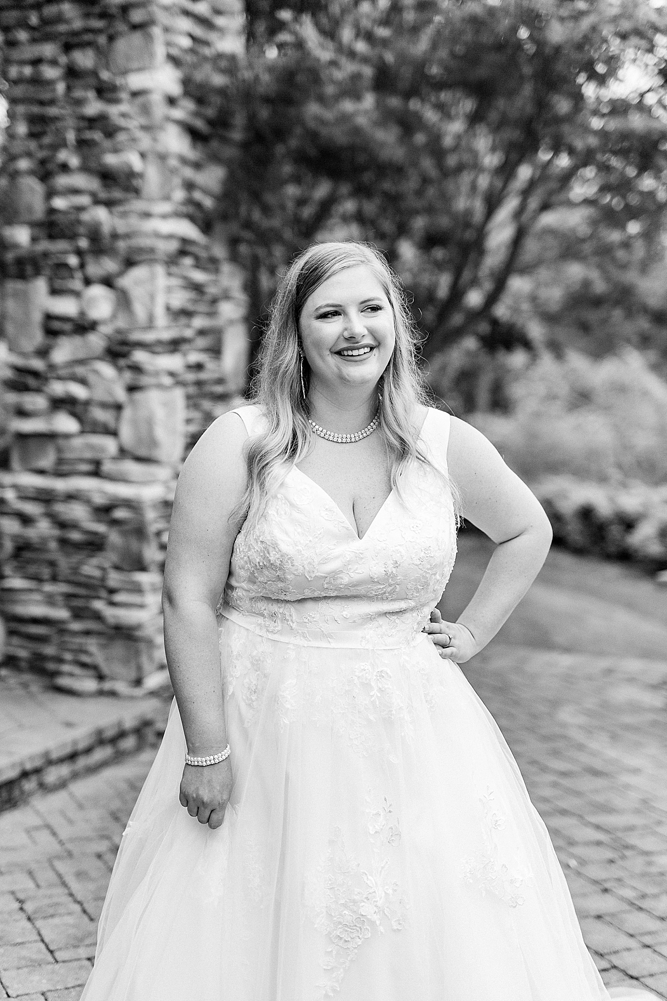 bride stands in classic wedding gown during The Arbors Bridal Portraits