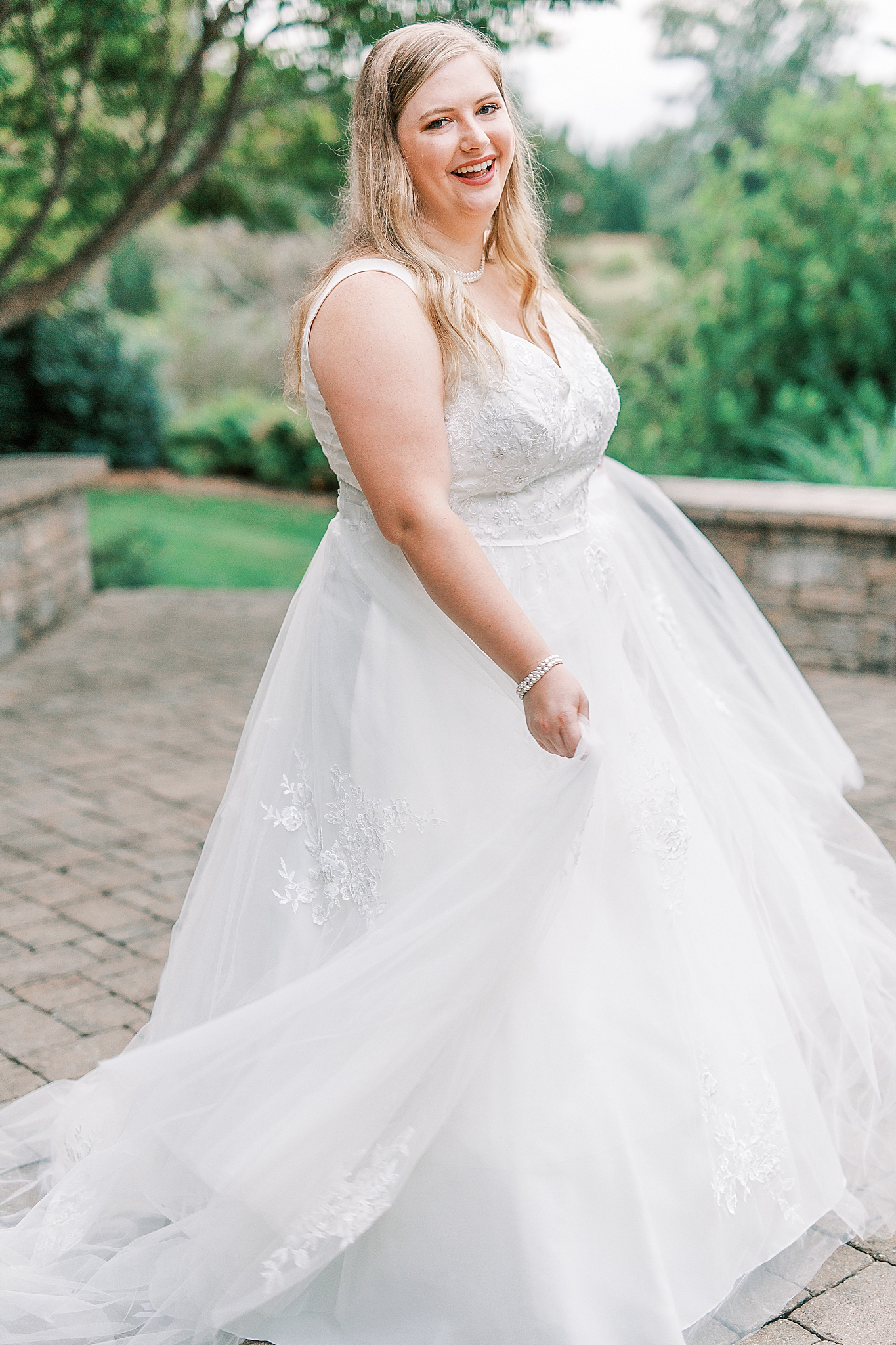 bride twirls during NC bridal session at the Arbors