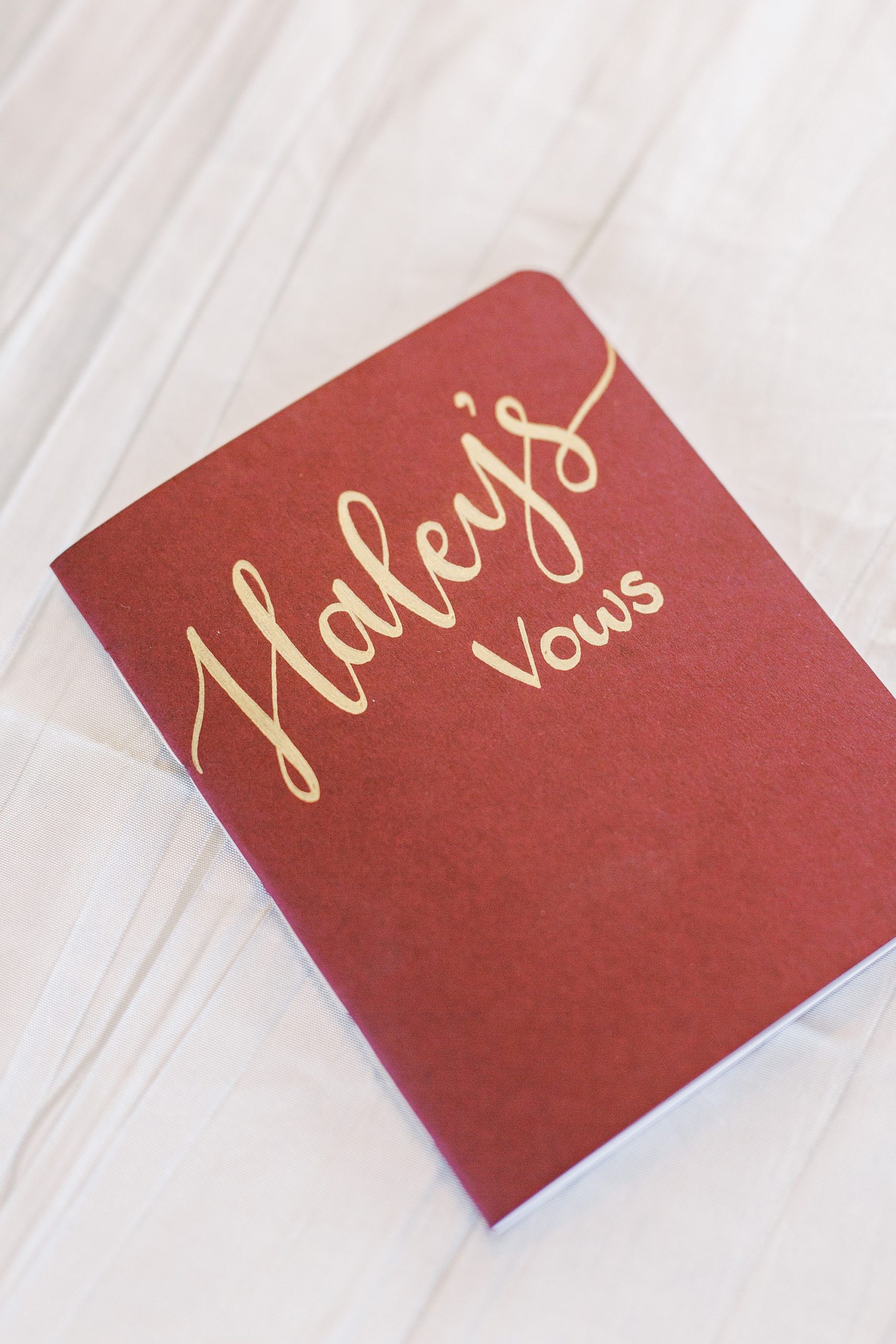 red and gold vow booklet for Arbors Events Wedding