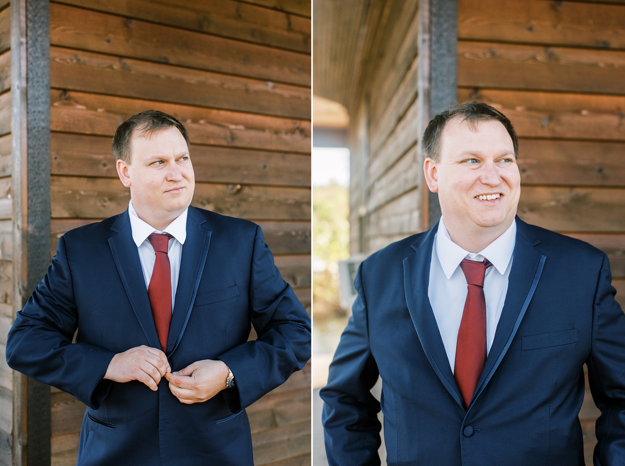 groom in navy suit with red tie poses before NC wedding