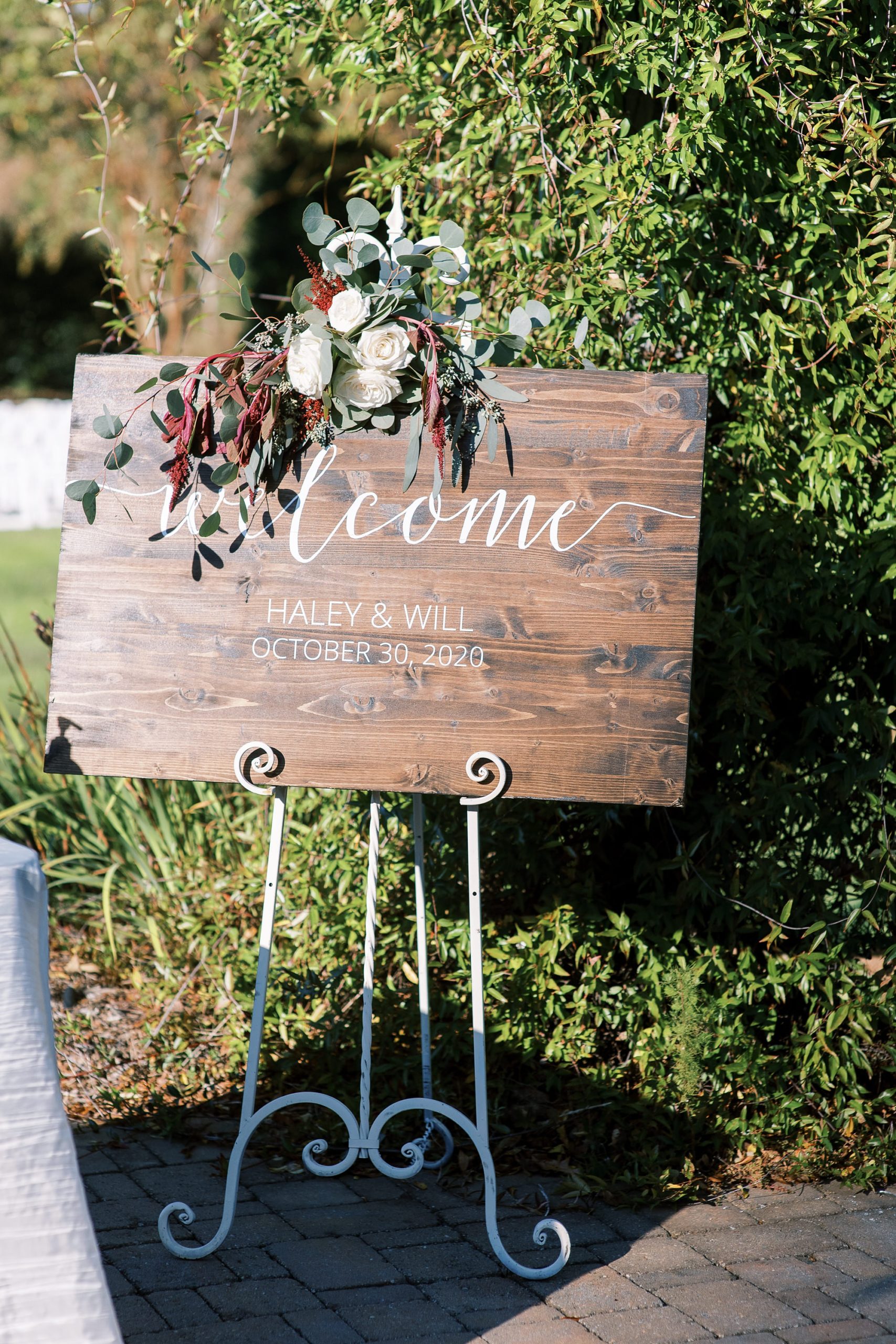 rustic wooden welcome sign for the Arbors Events wedding ceremony