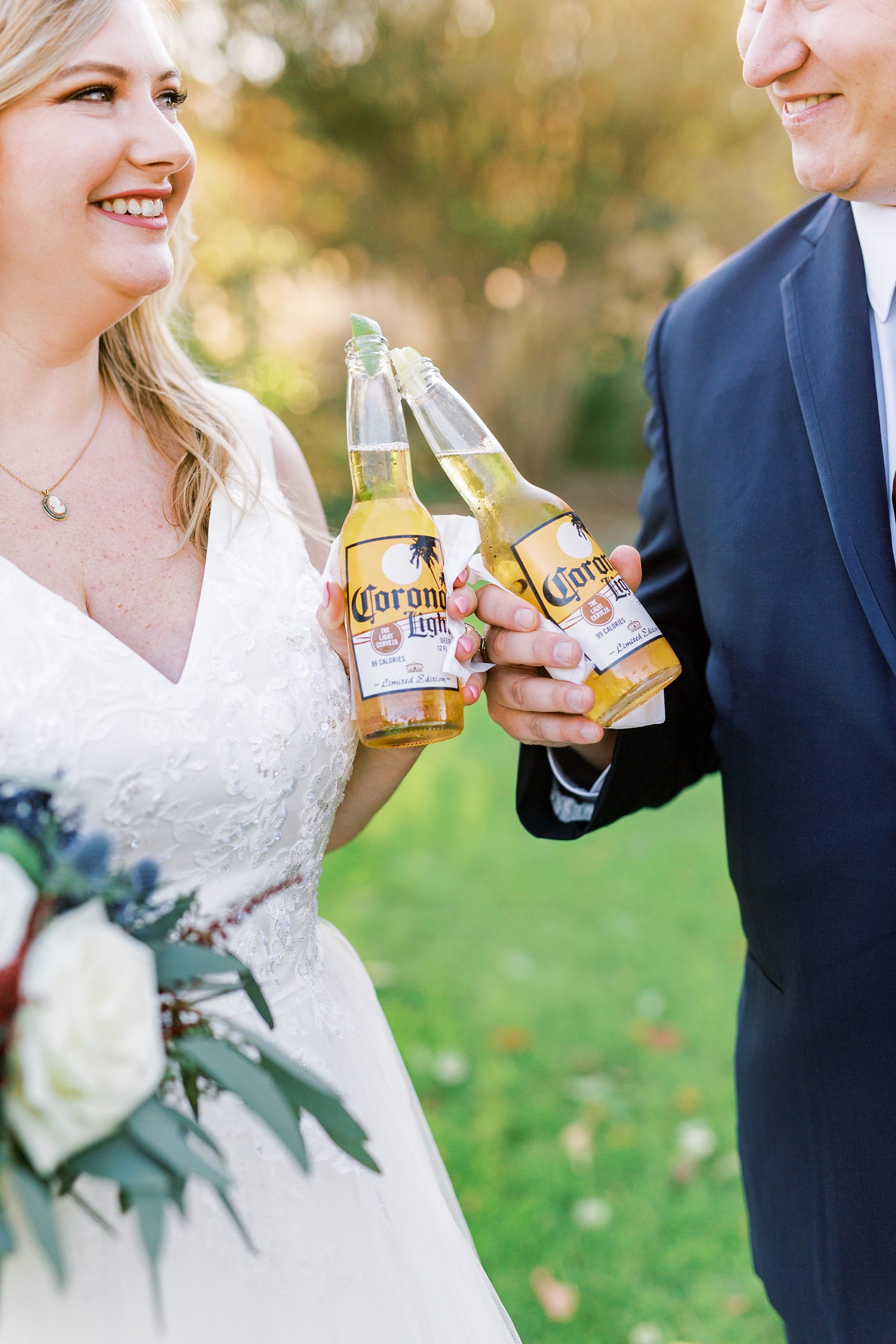 newlyweds toast with Corona beers during COVID-19 wedding