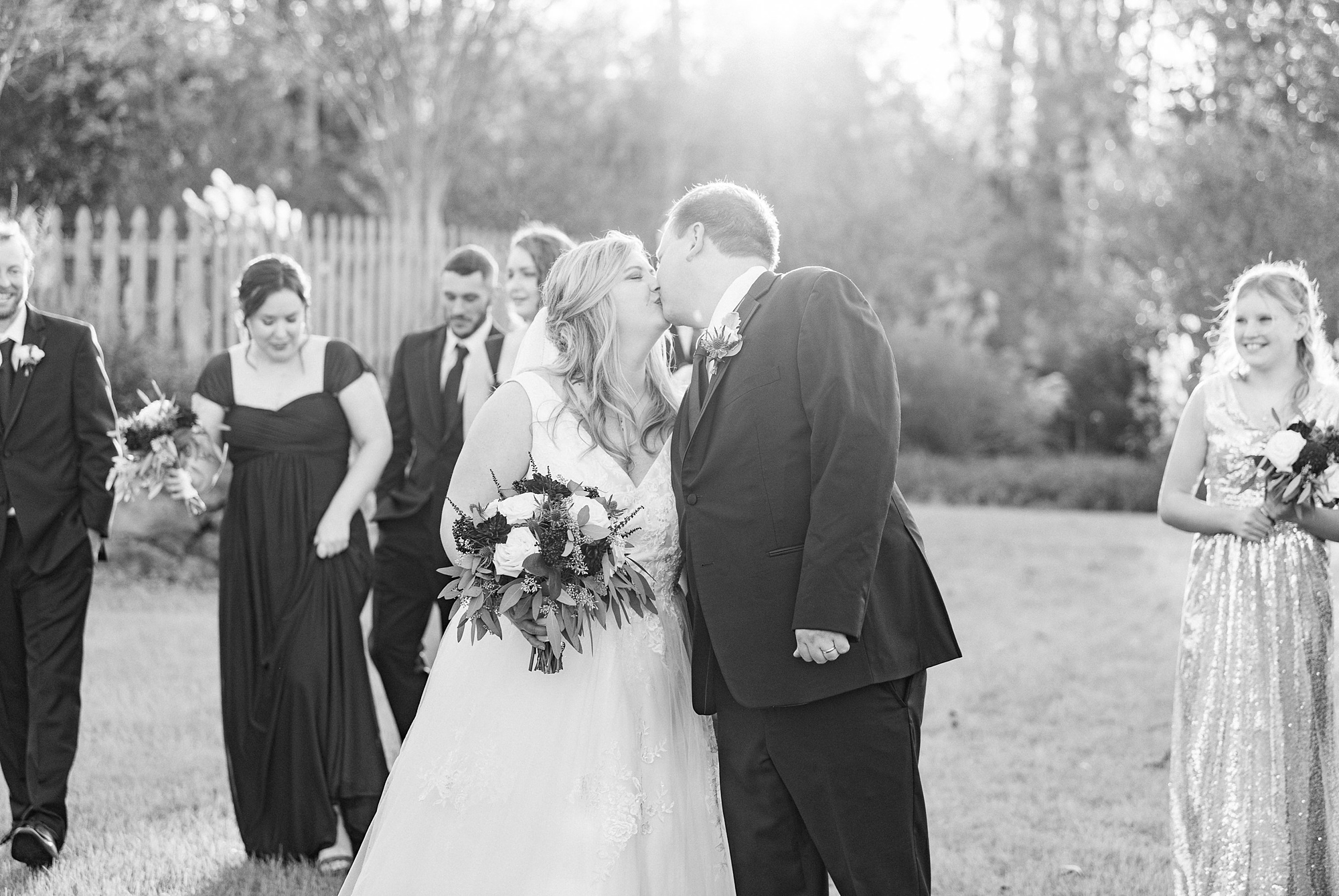 bride and groom kiss during NC wedding photos