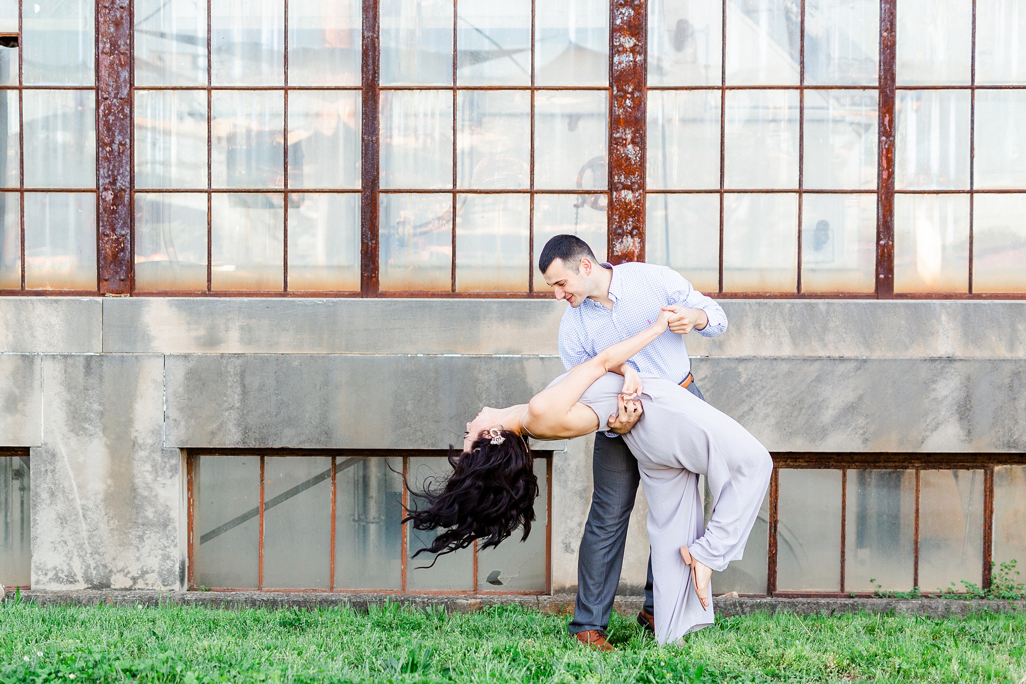 groom dips bride during NC engagement photos