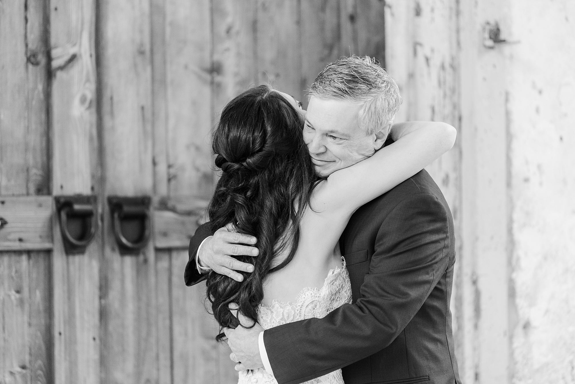 dad hugs bride during first look