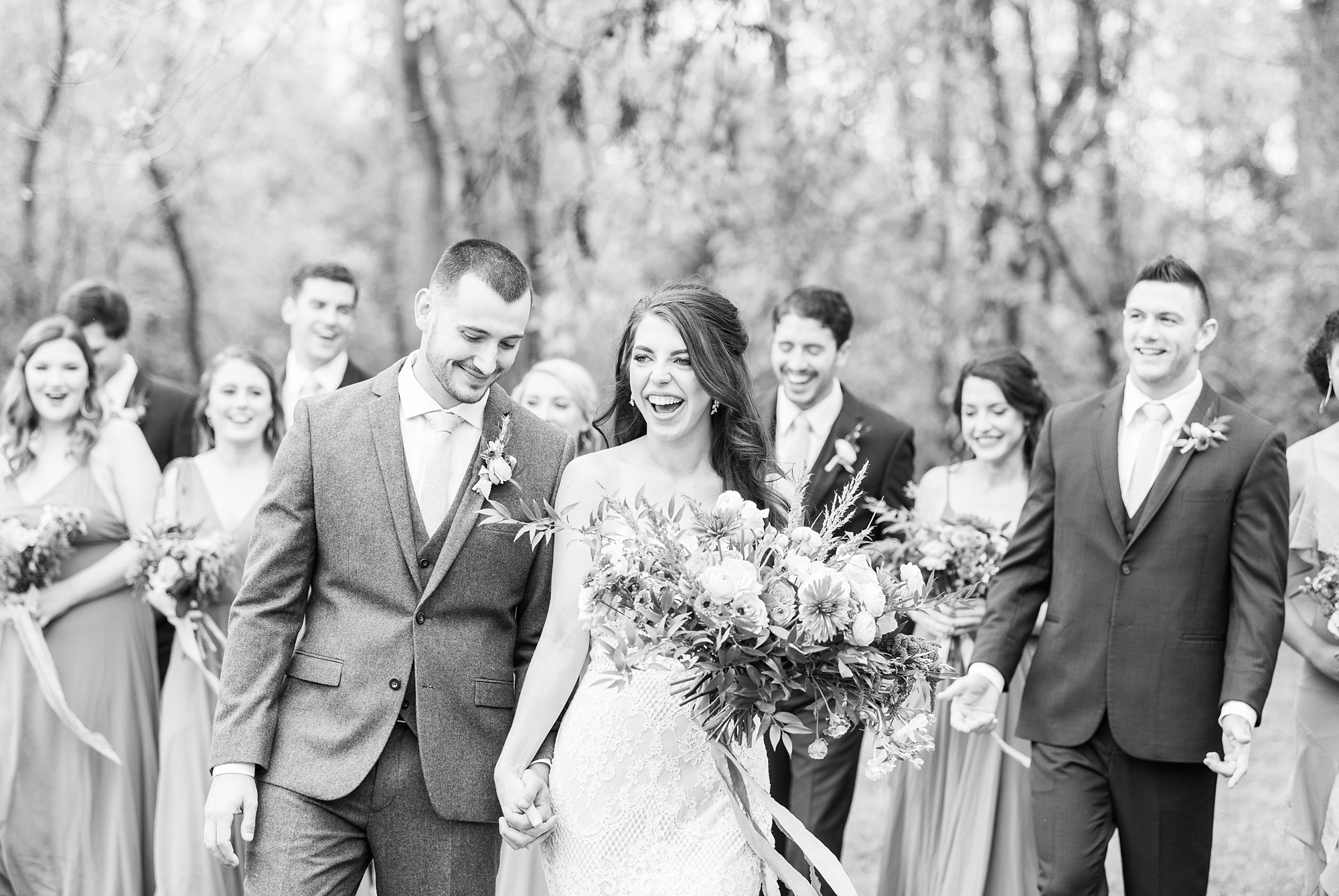 bride laughs during wedding party portraits in North Carolina