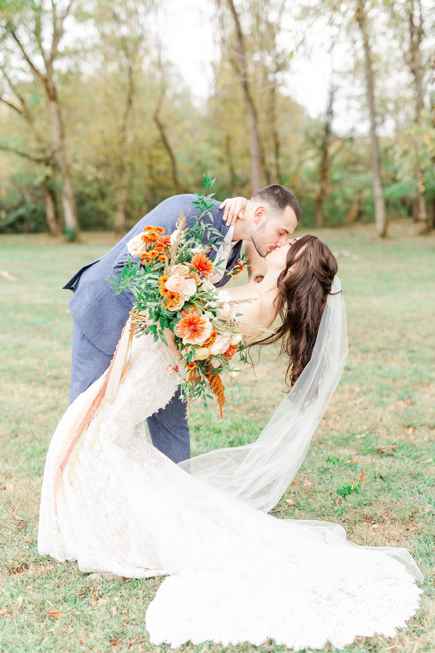 fall wedding day in Maiden NC with groom dipping bride to kiss
