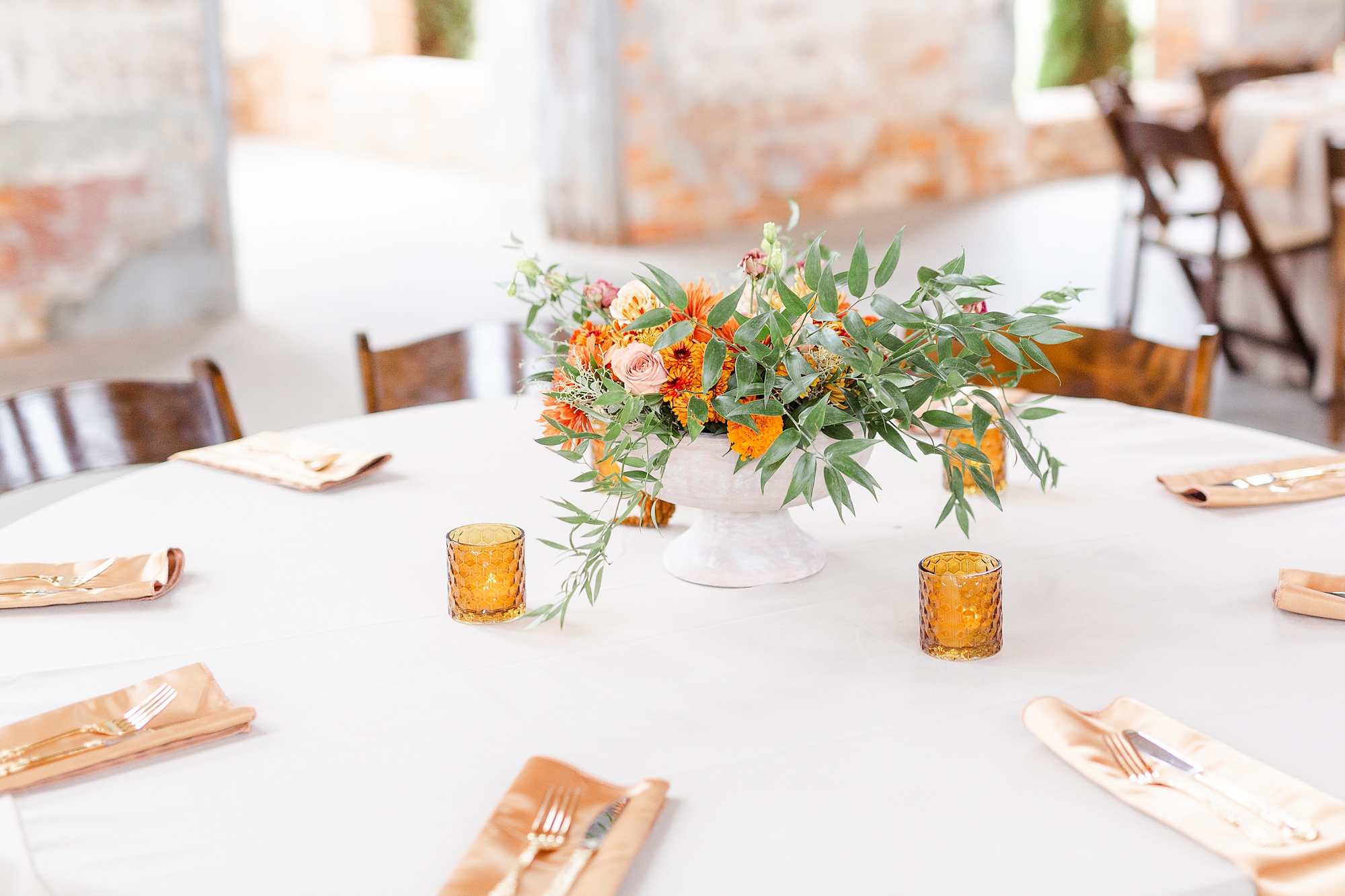 floral centerpieces with orange and green florals