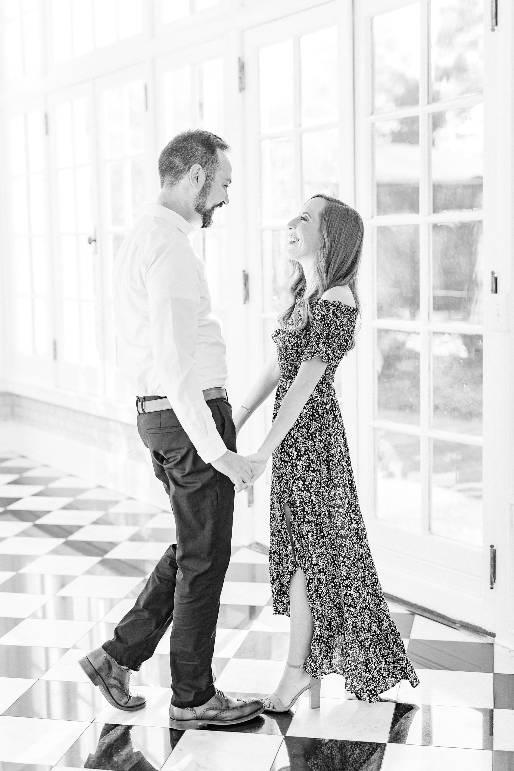 engaged couple laughs in veranda of Separk Mansion