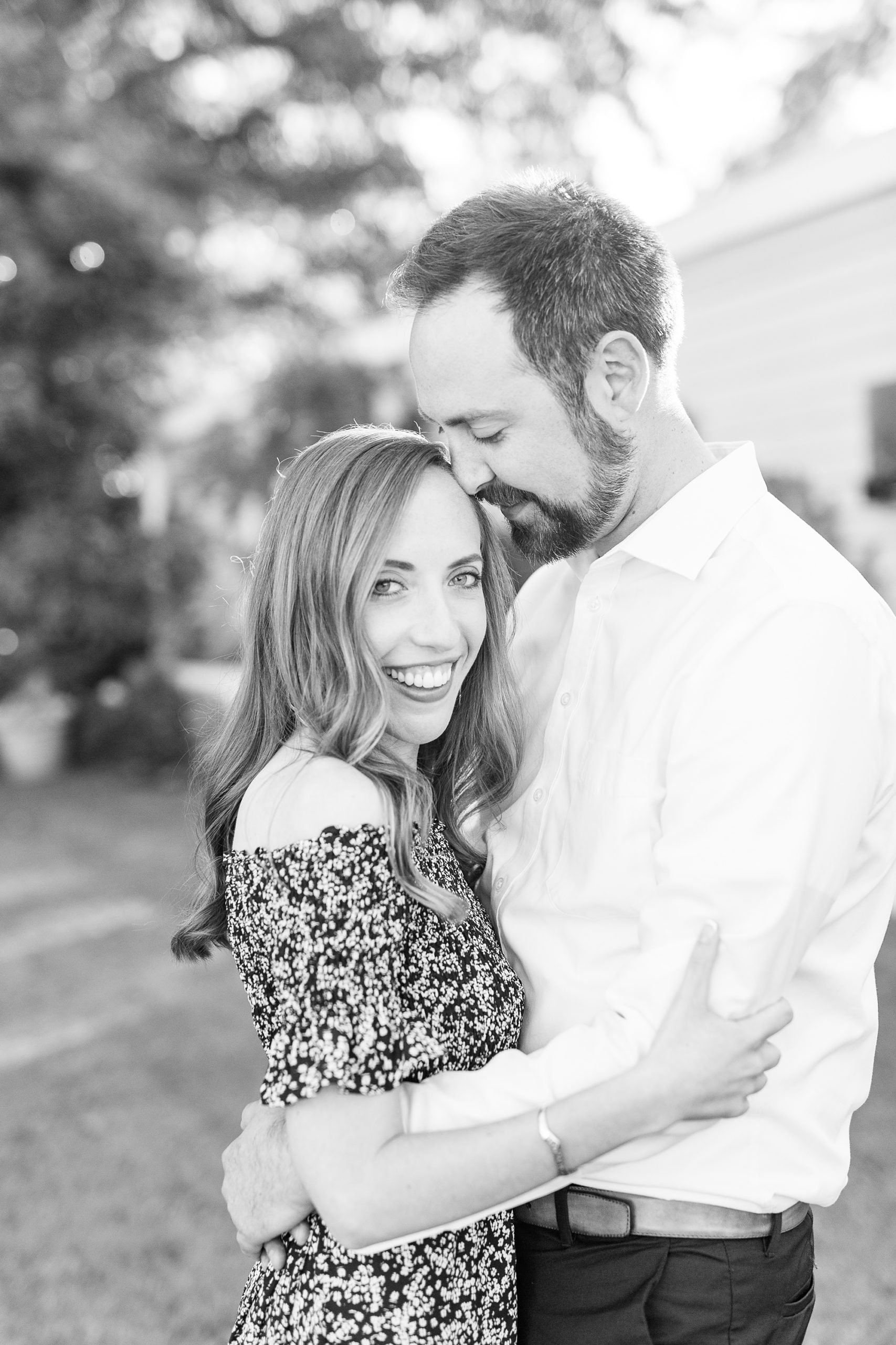 groom nuzzles bride's head during NC engagement session