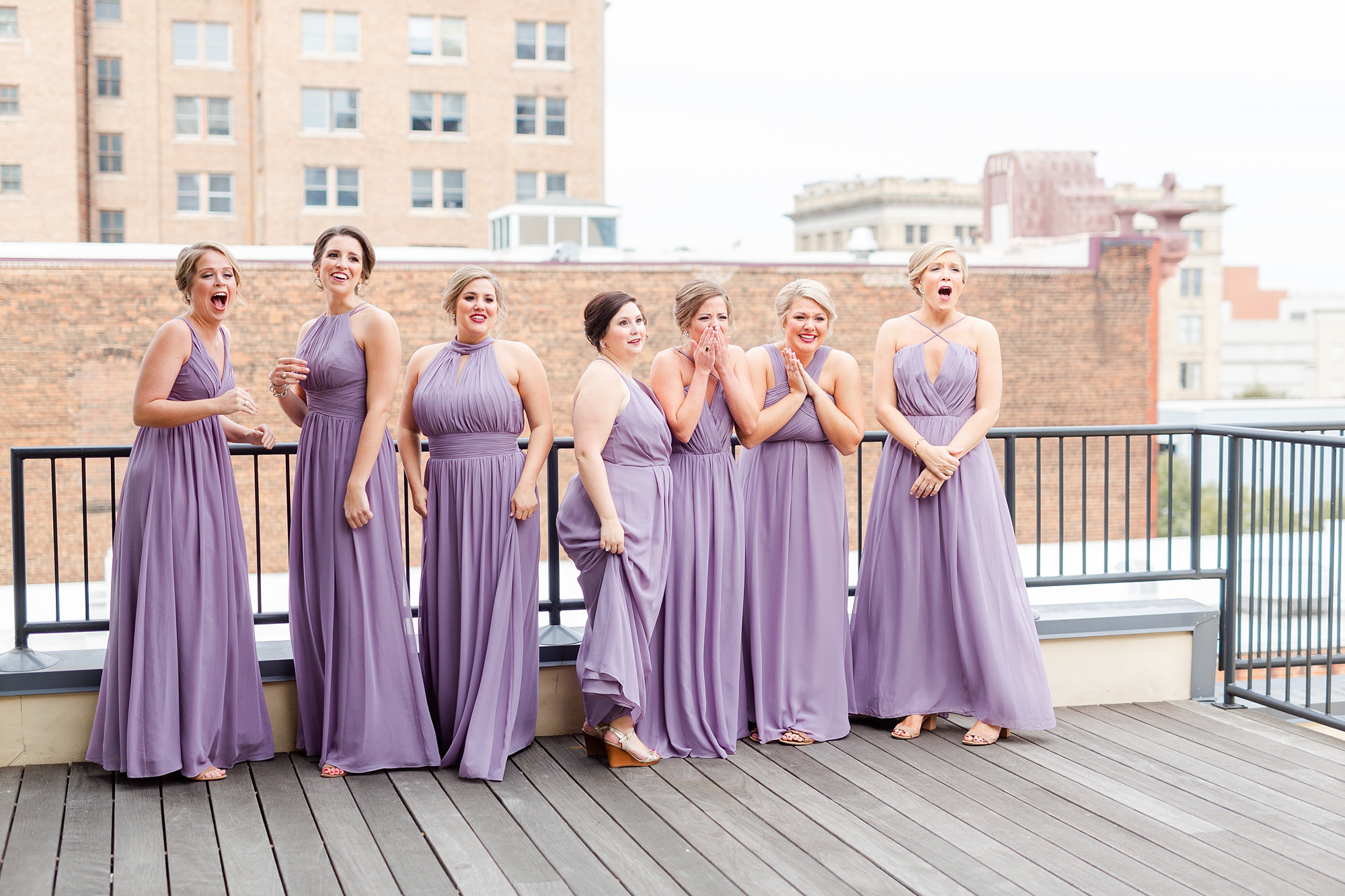 first look with bridesmaids on roof of Stockroom at 230