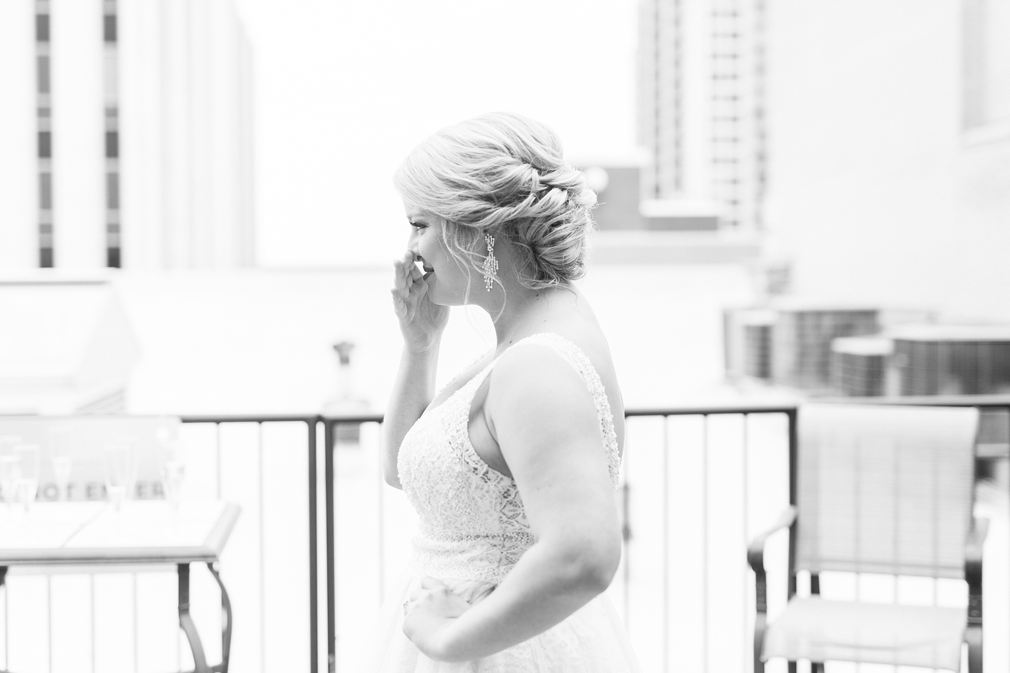 bride cries during first look with bridesmaids