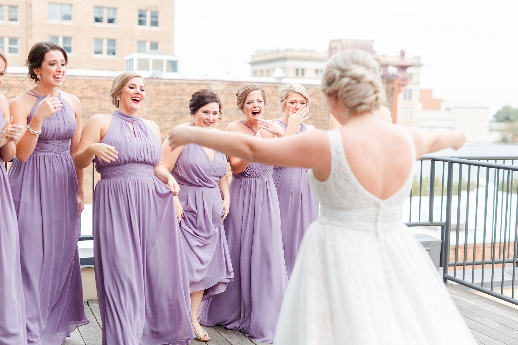 bride walks to bridesmaids during first look