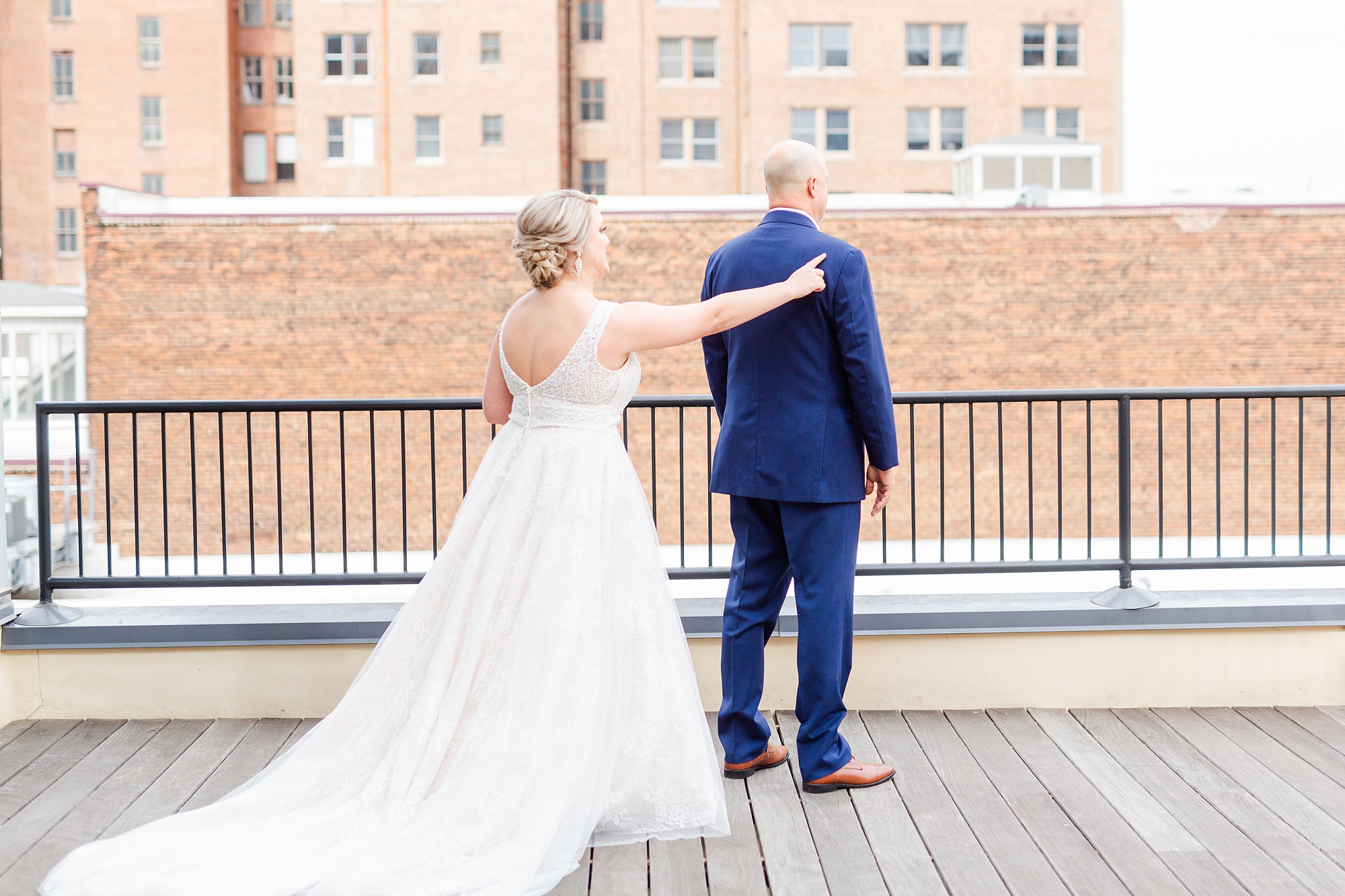 bride and dad have first look on roof of Stockroom at 230