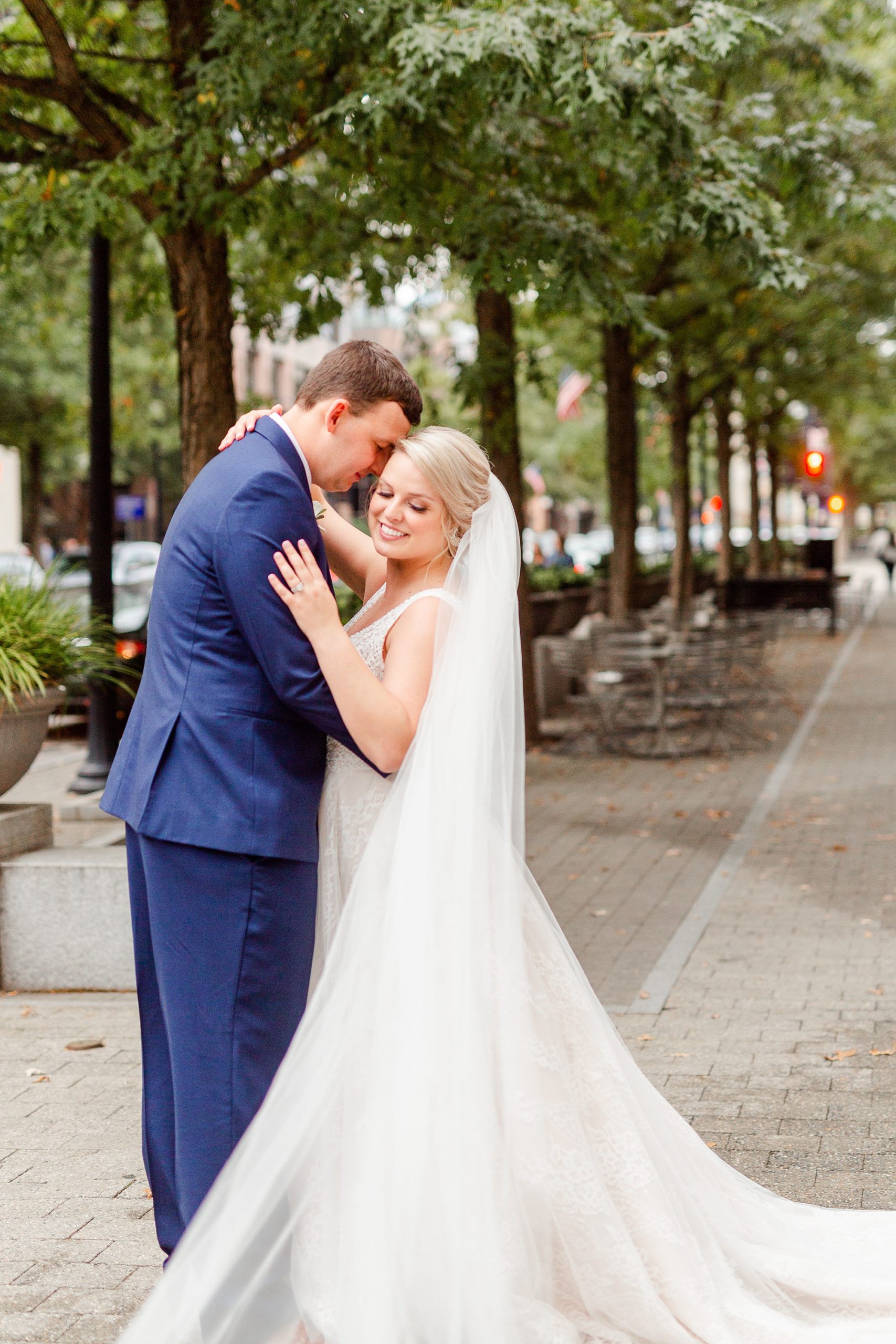 groom nuzzles bride's cheek in Raleigh NC