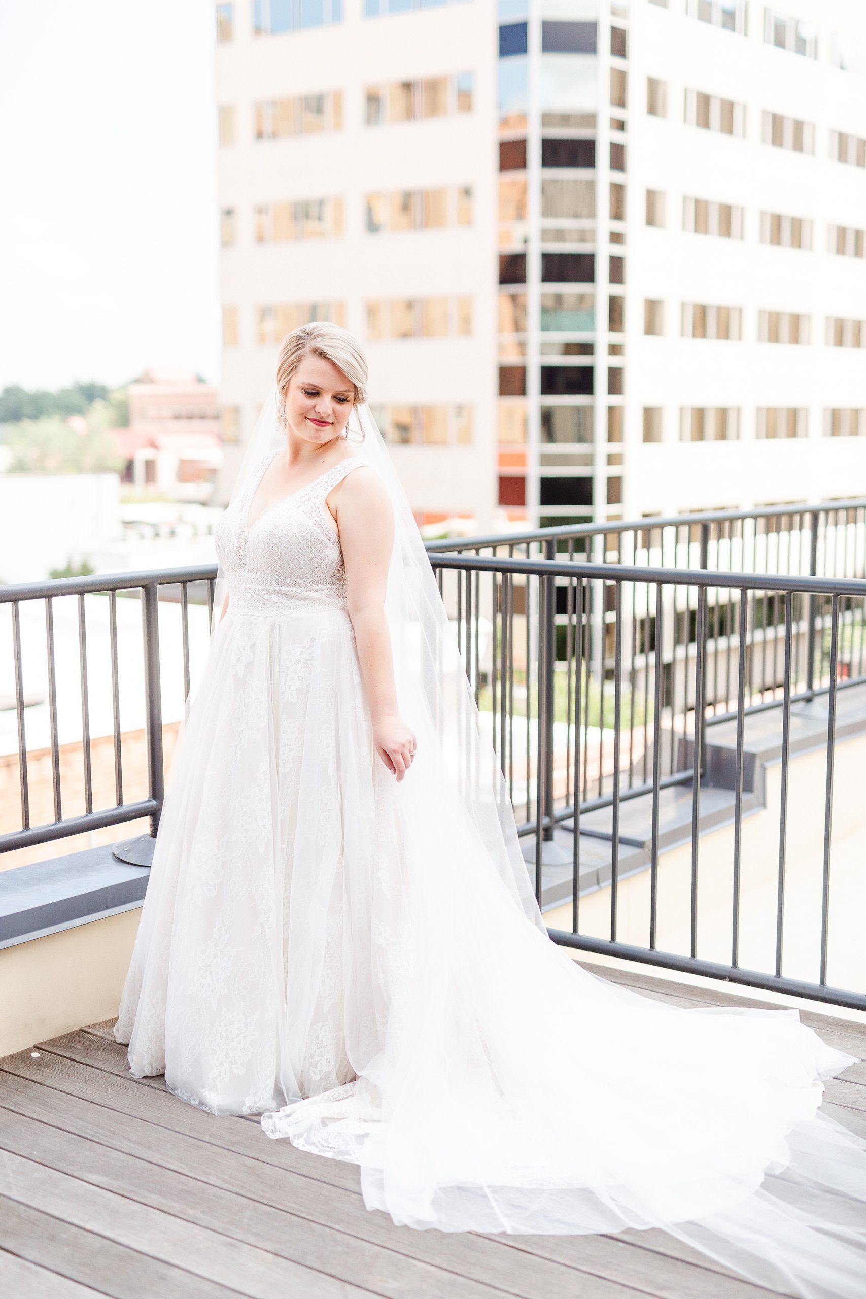 bride pose on balcony with veil