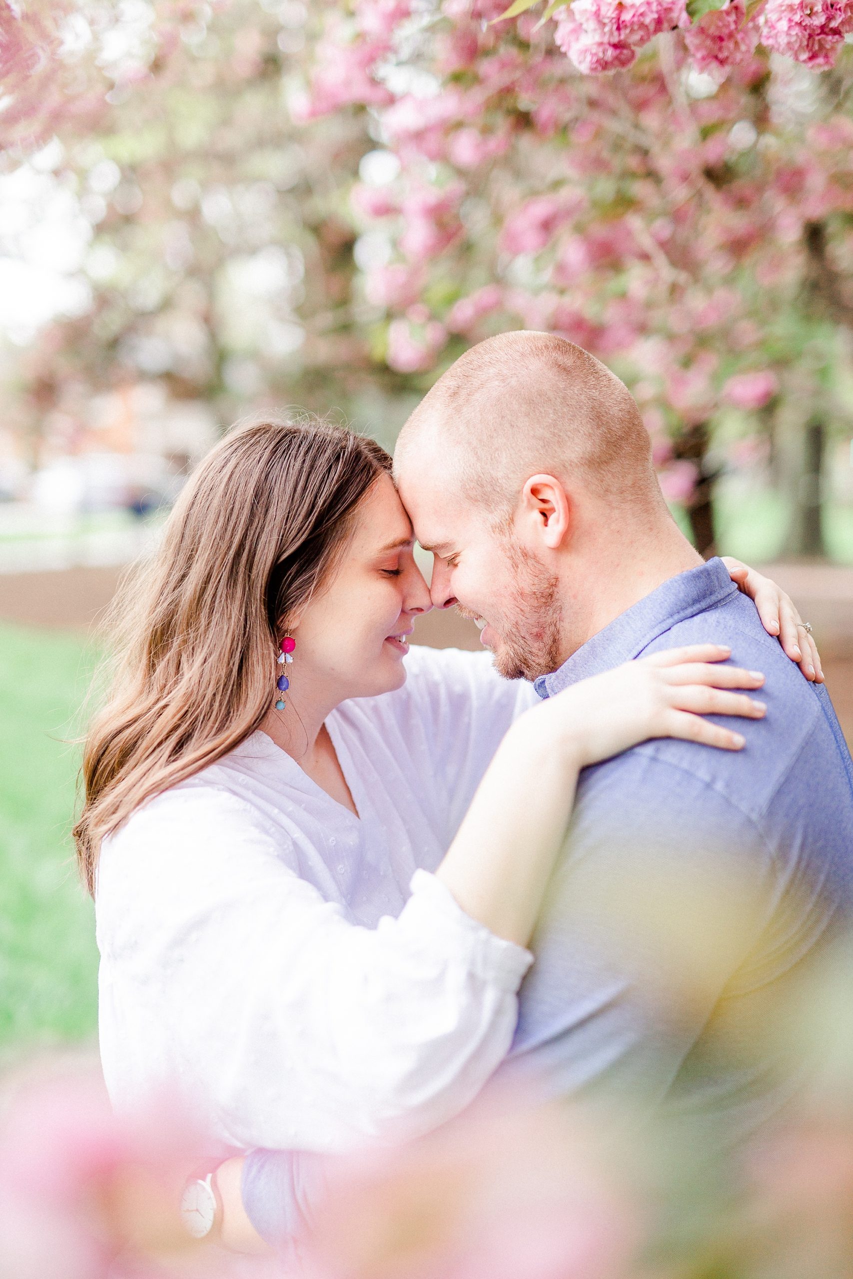 Downtown Davidson NC engagement portraits in cherry blossom tree