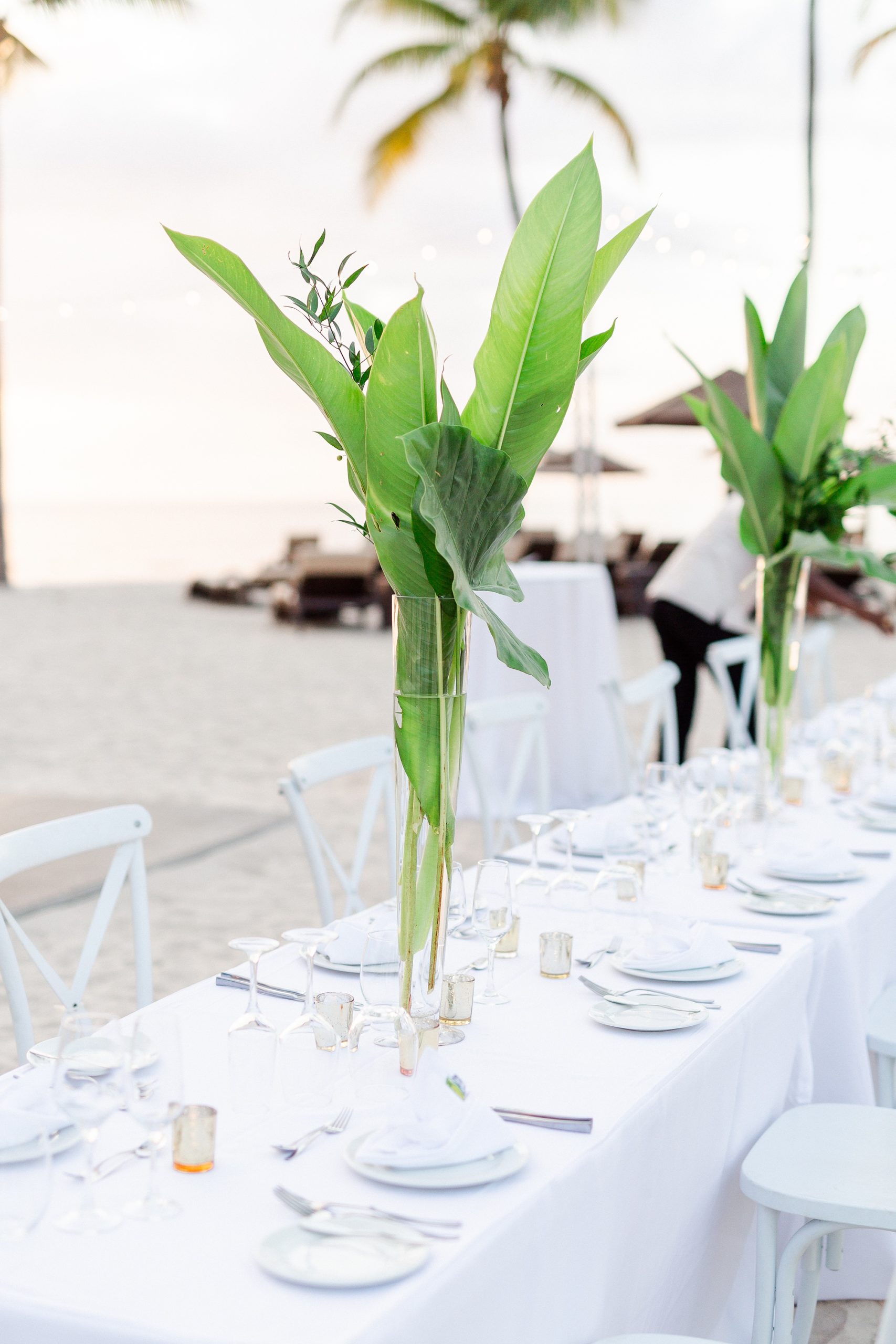 tall green floral centerpieces for beach reception