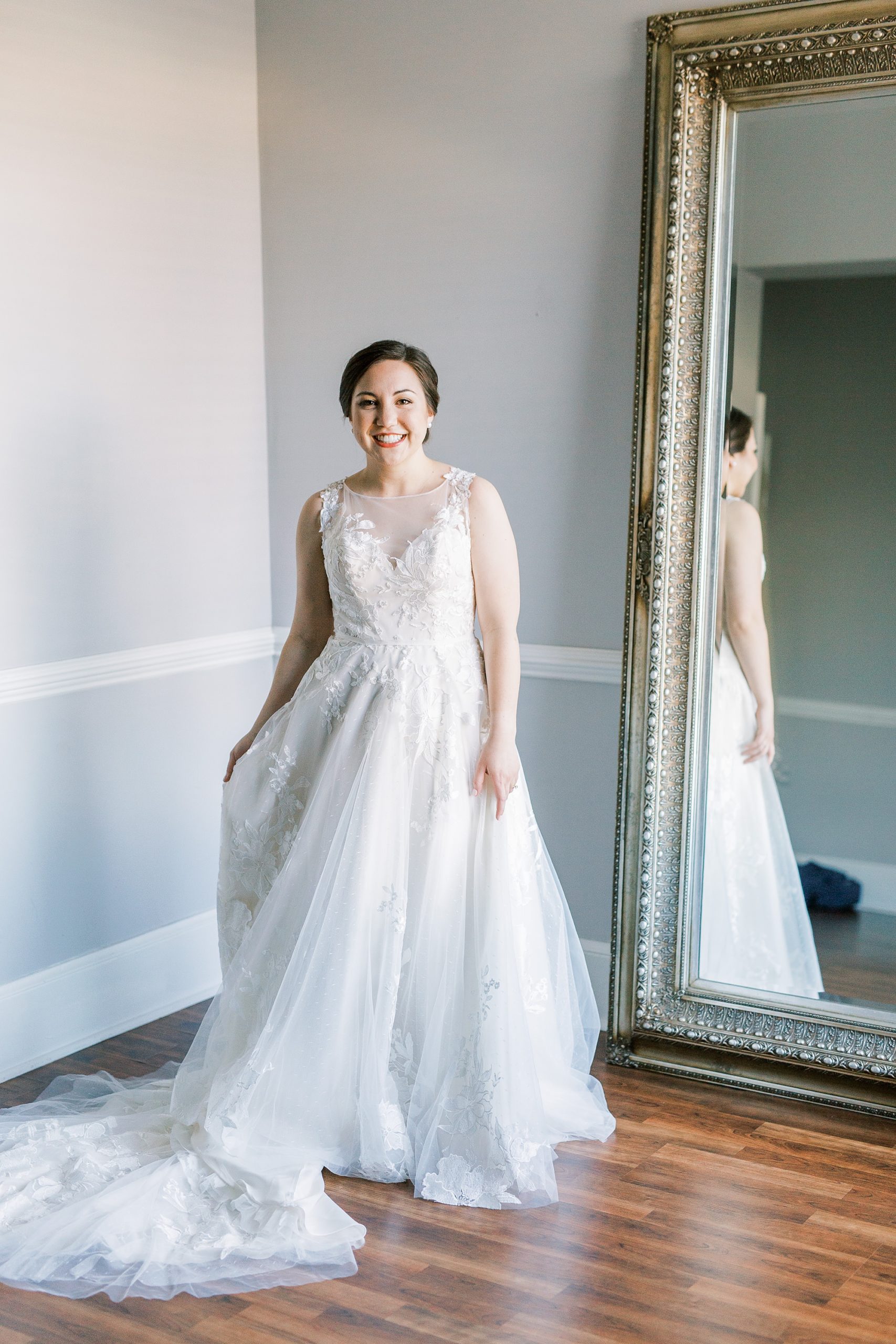 bride shows off classic wedding gown for mauve fall wedding day