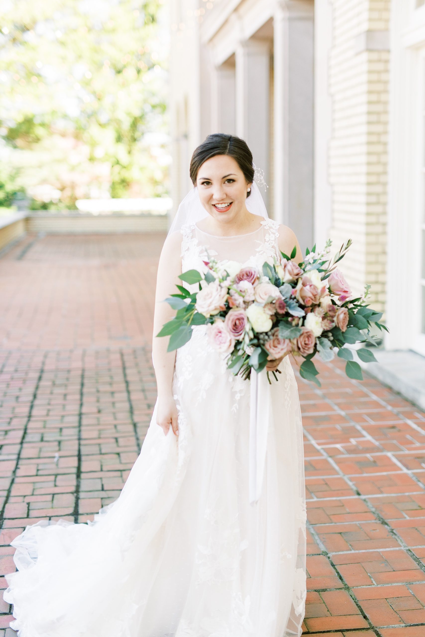 mauve fall wedding bouquet and bride in classic gown