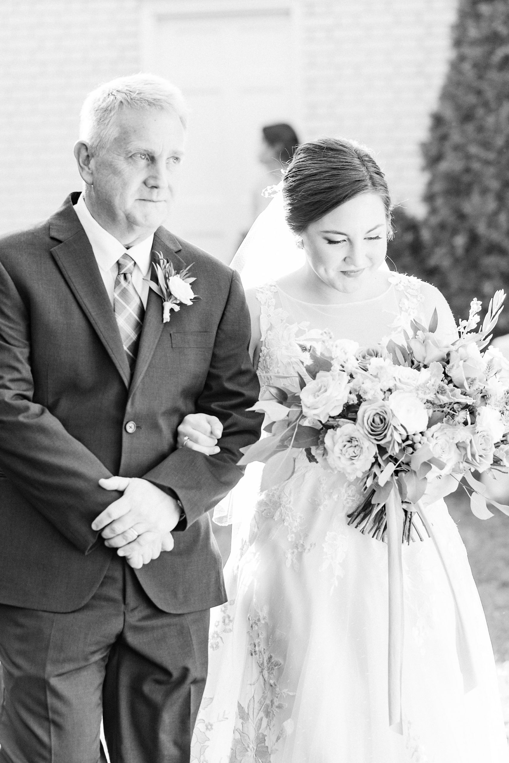 bride walks down aisle at Separk Mansion during mauve fall wedding ceremony