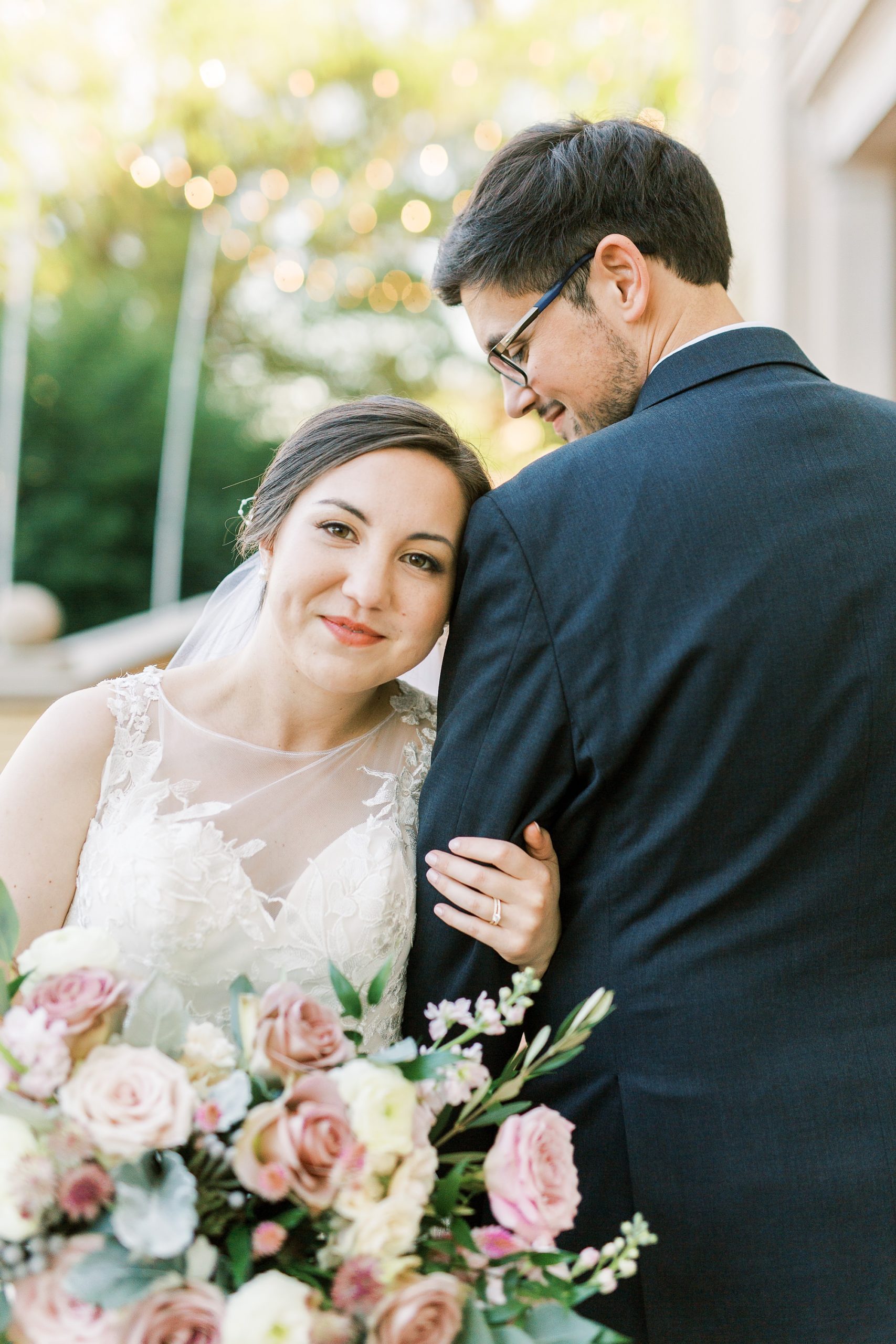 bride leans against groom's shoulder on patio at Separk Mansion