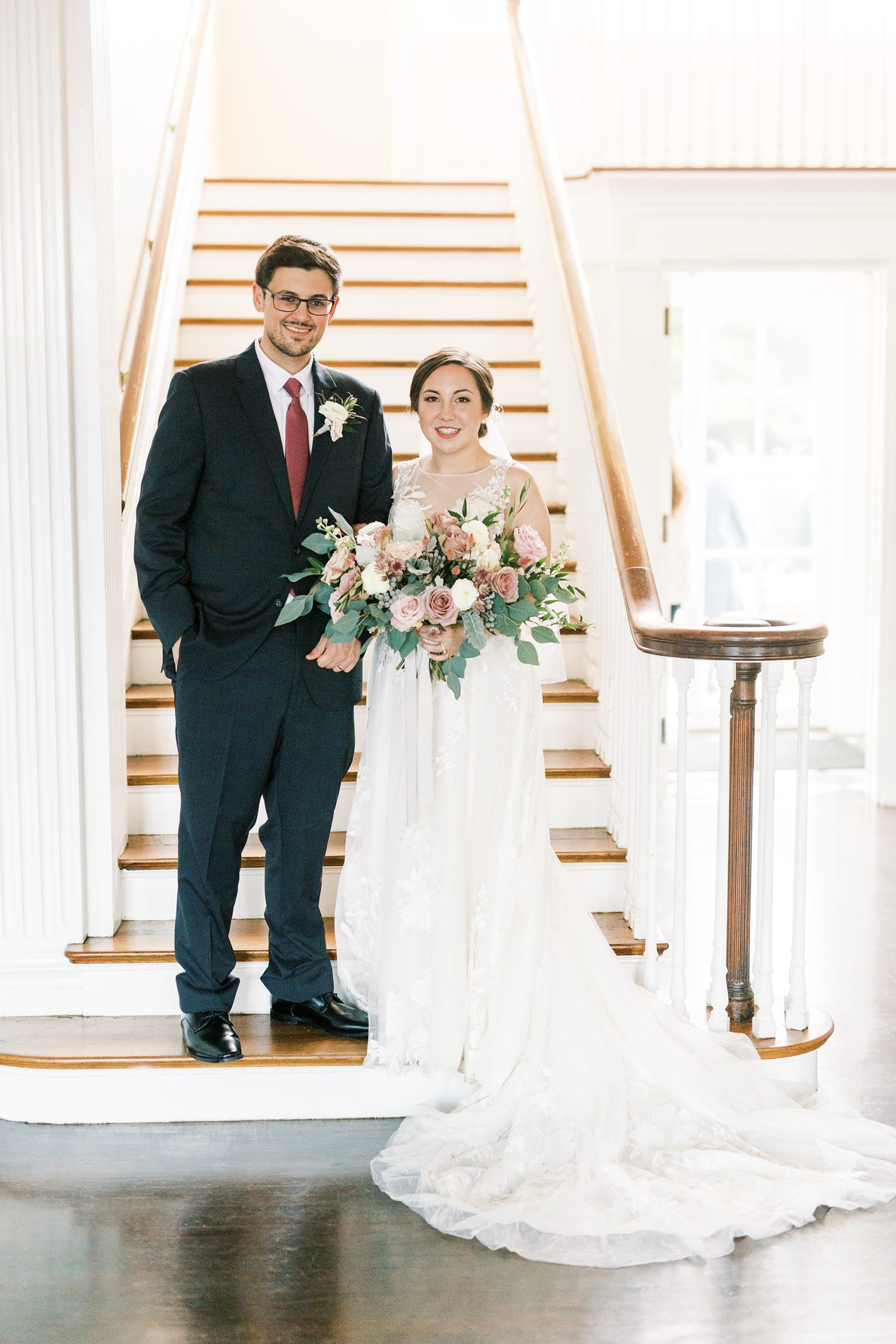 bride and groom pose on steps of Separk Mansion