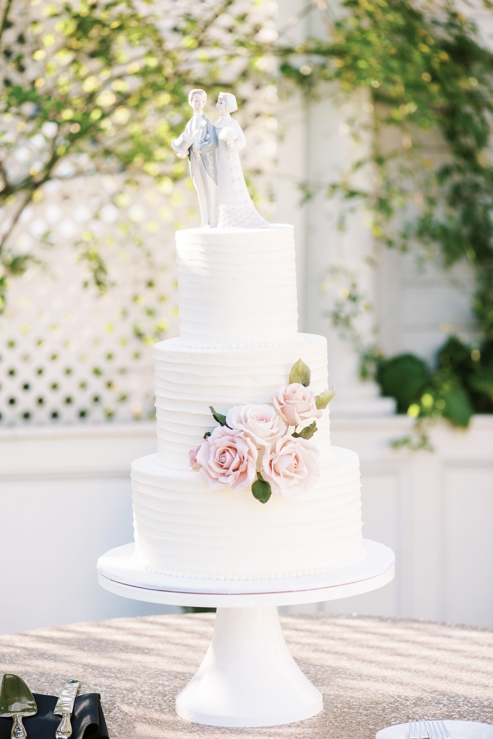 tiered wedding cake with classic cake topper