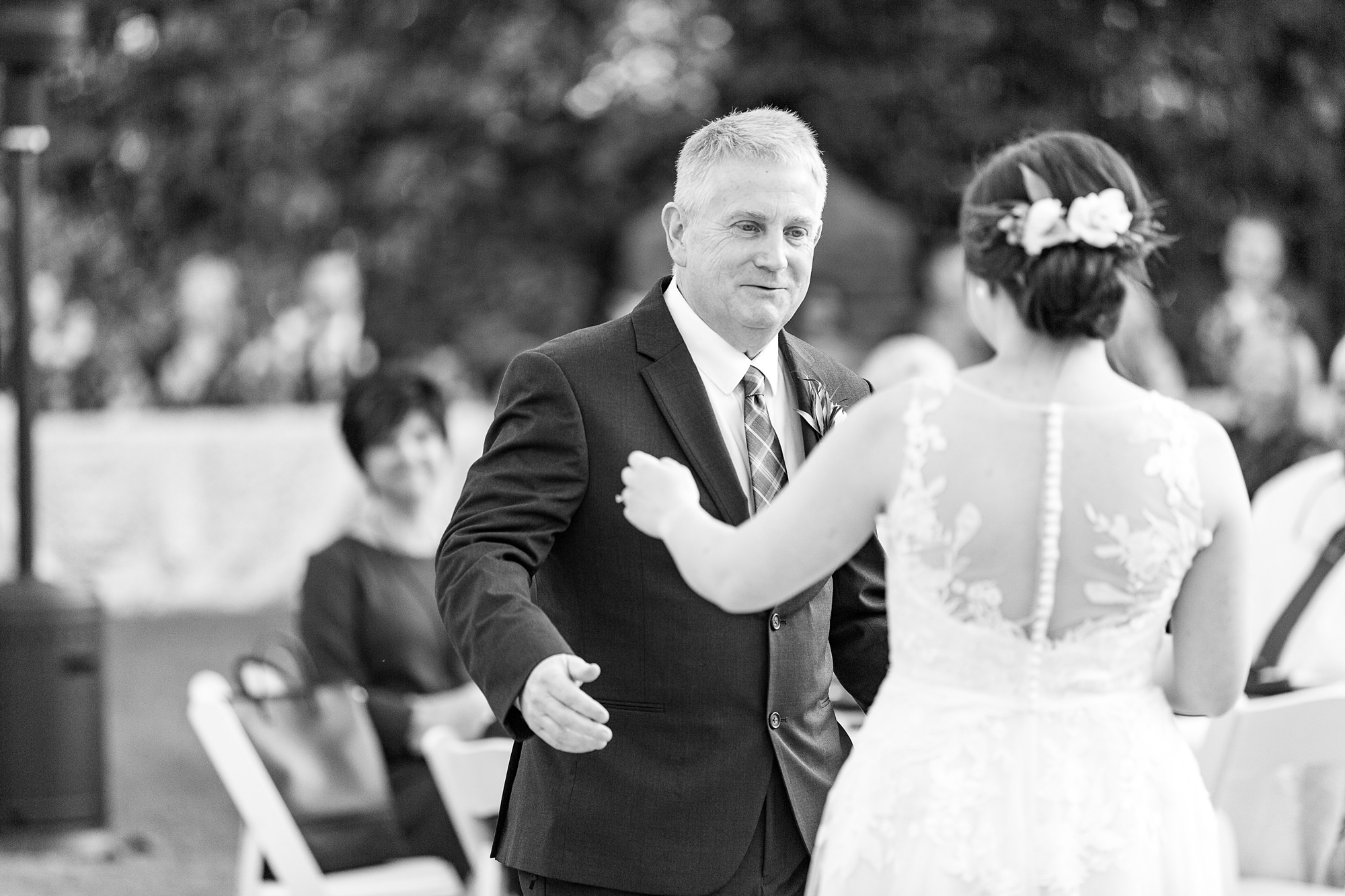 father of bride walks to dance floor