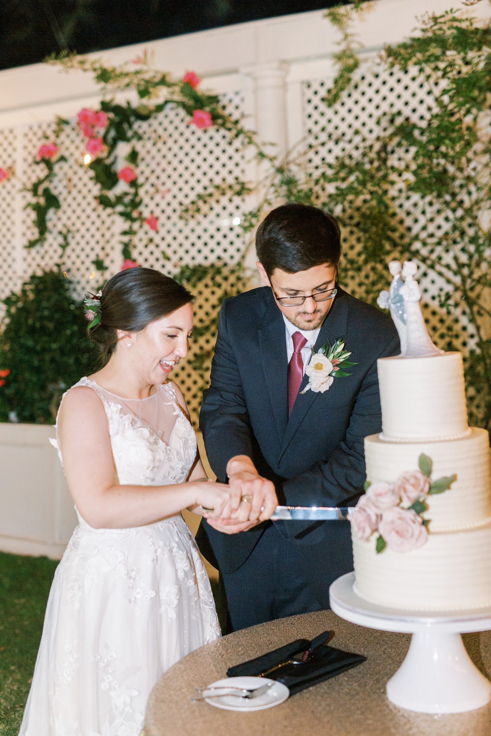 bride and groom cut wedding cake at Separk Mansion