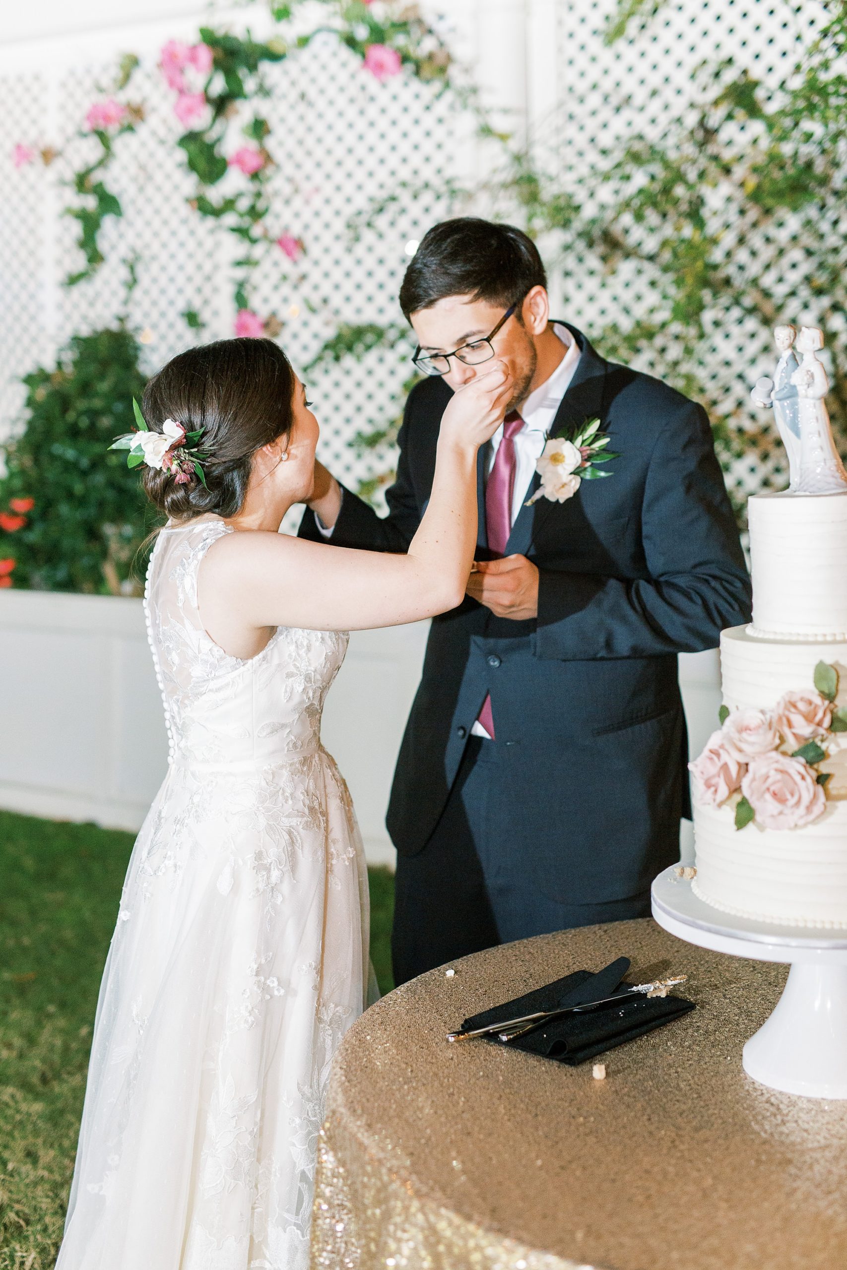 bride and groom cut wedding cake at Separk Mansion