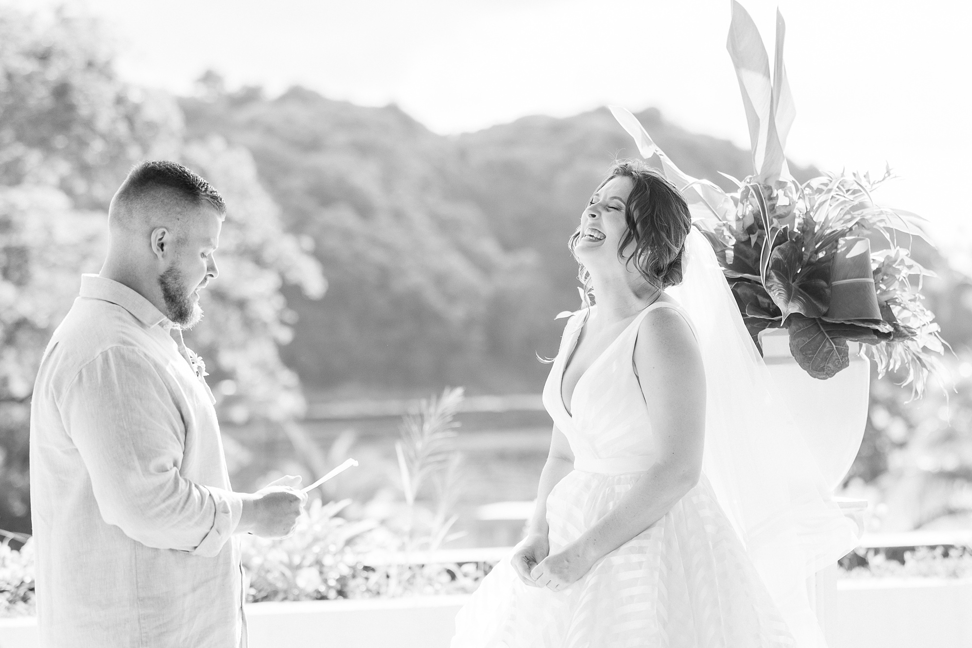 groom makes bride laugh with wedding vows