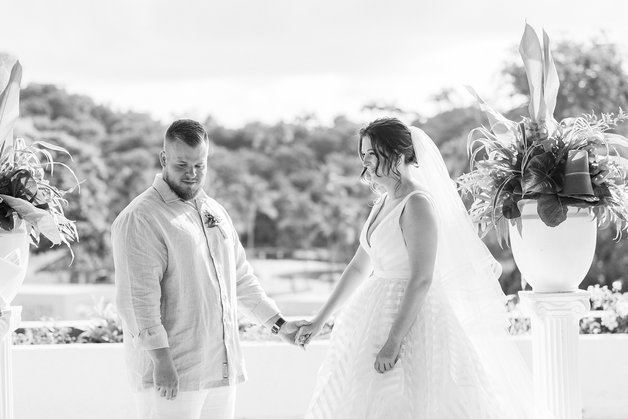 bride and groom listen to reading during St Lucia resort wedding ceremony