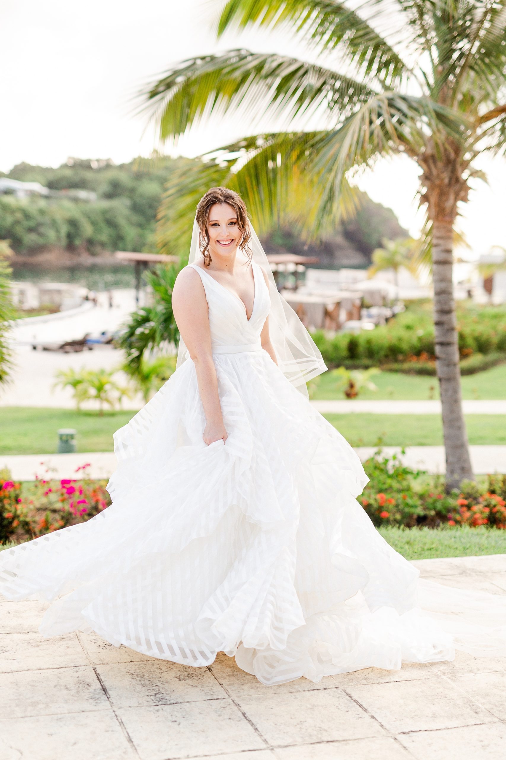 St Lucia resort wedding portraits of bride twirling