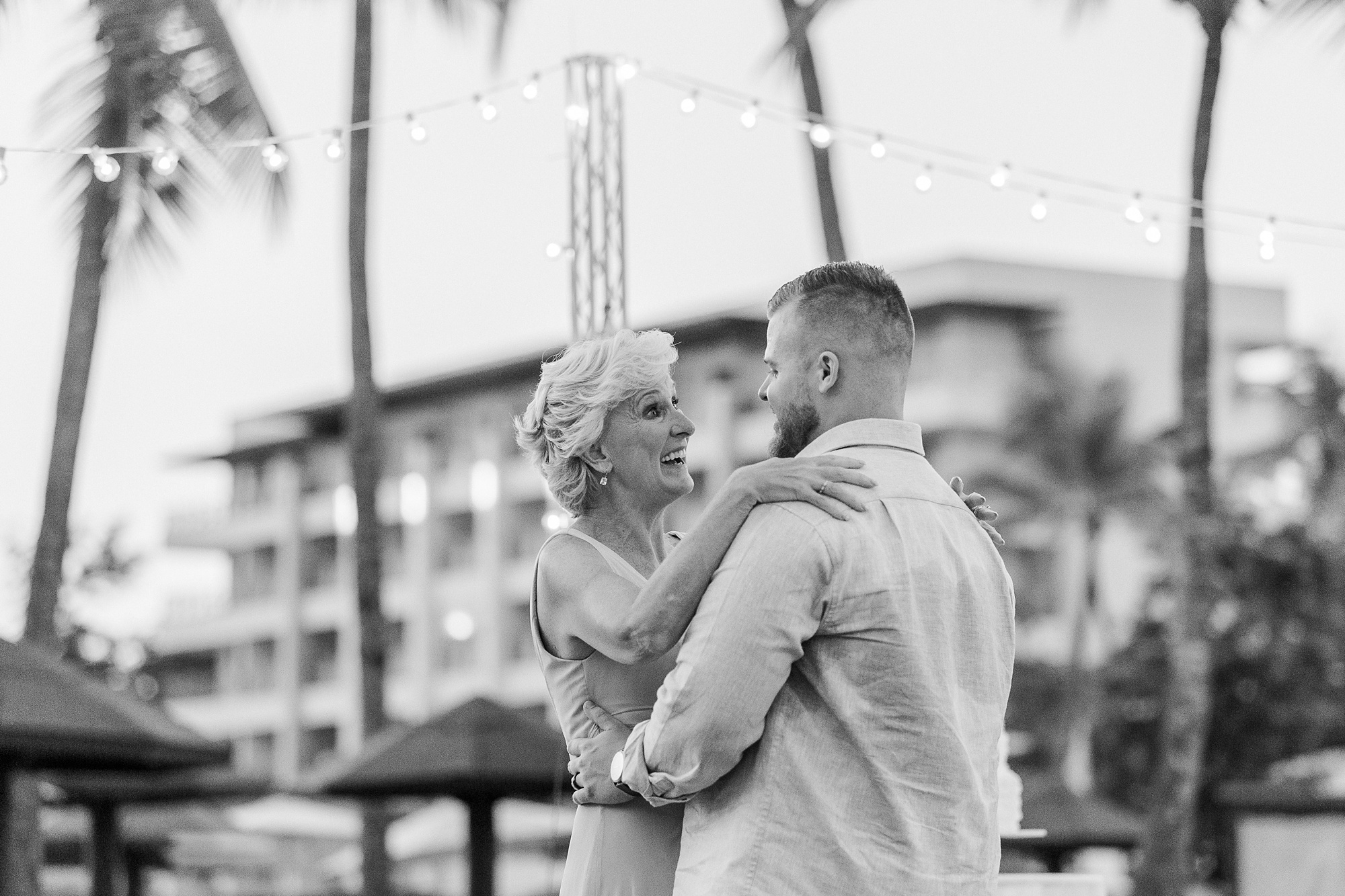groom and mother dance on beach in St Lucia