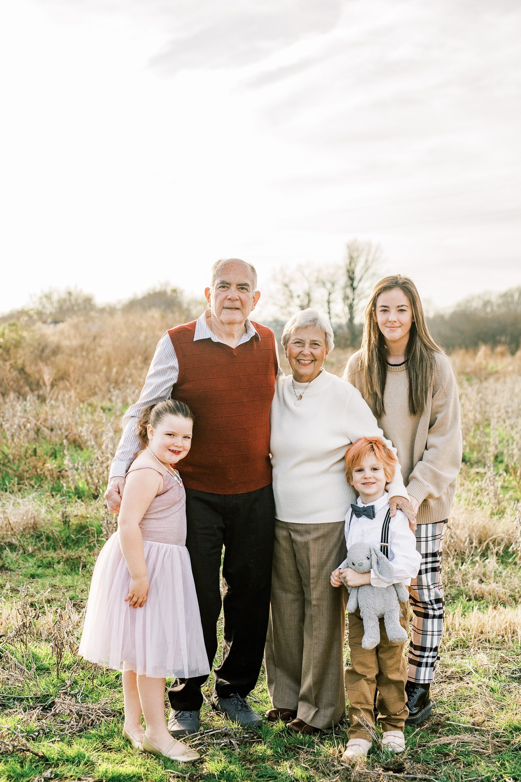 grandparents pose with grandchildren during 50th anniversary photos