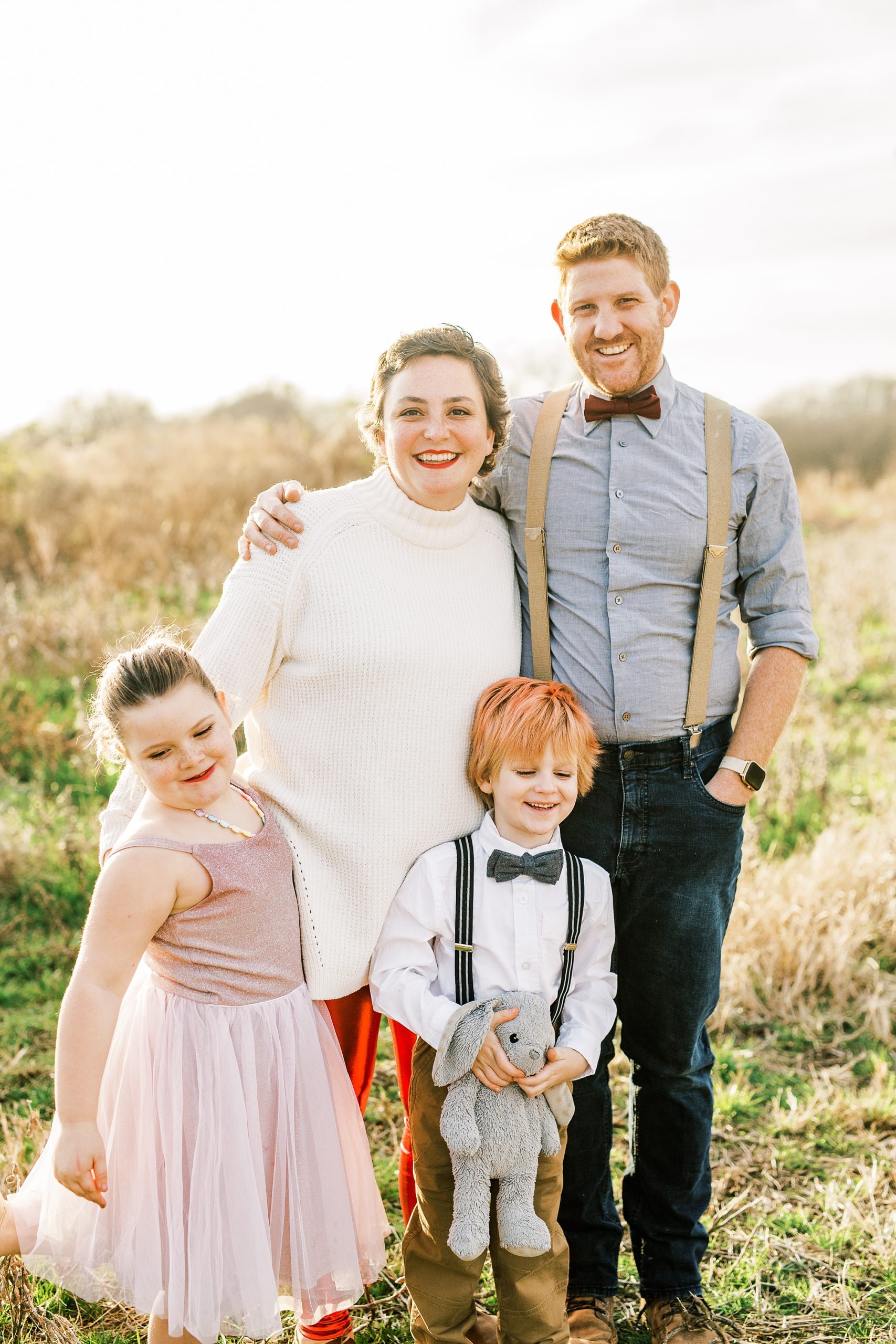 daughter poses with husband and two children
