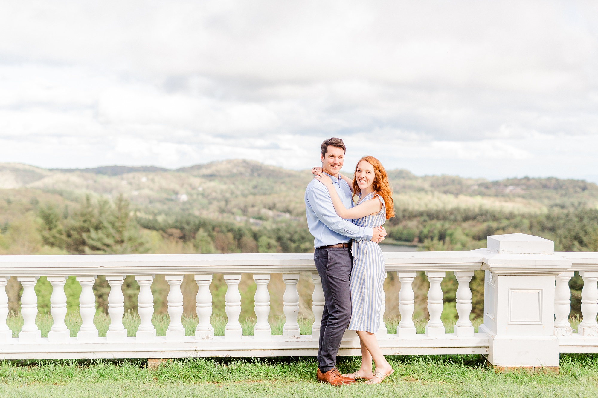 Boone NC spring engagement photos on balcony of Moses Cone Manor overlooking the mountains